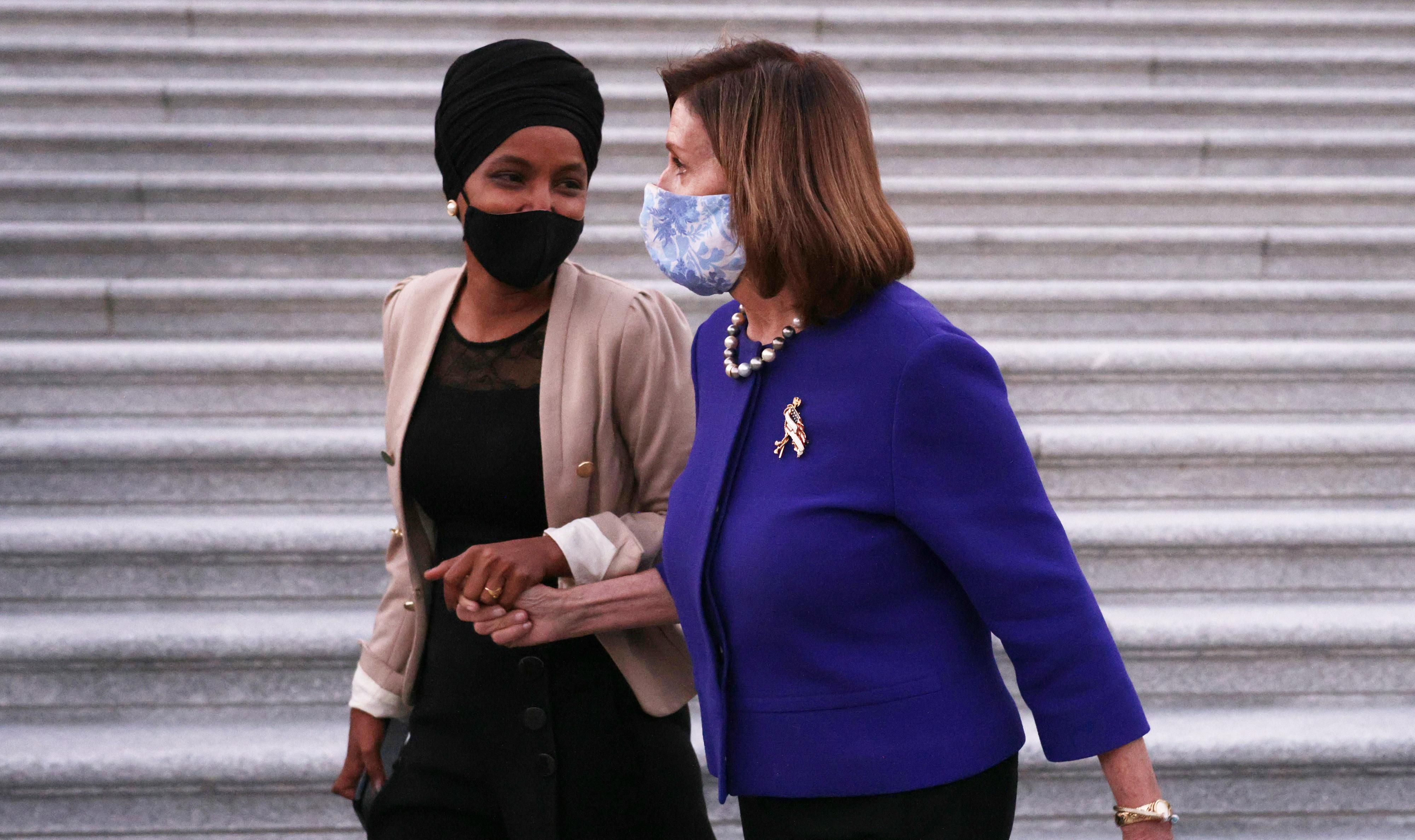 Ilhan Omar walking with Nancy Pelosi
