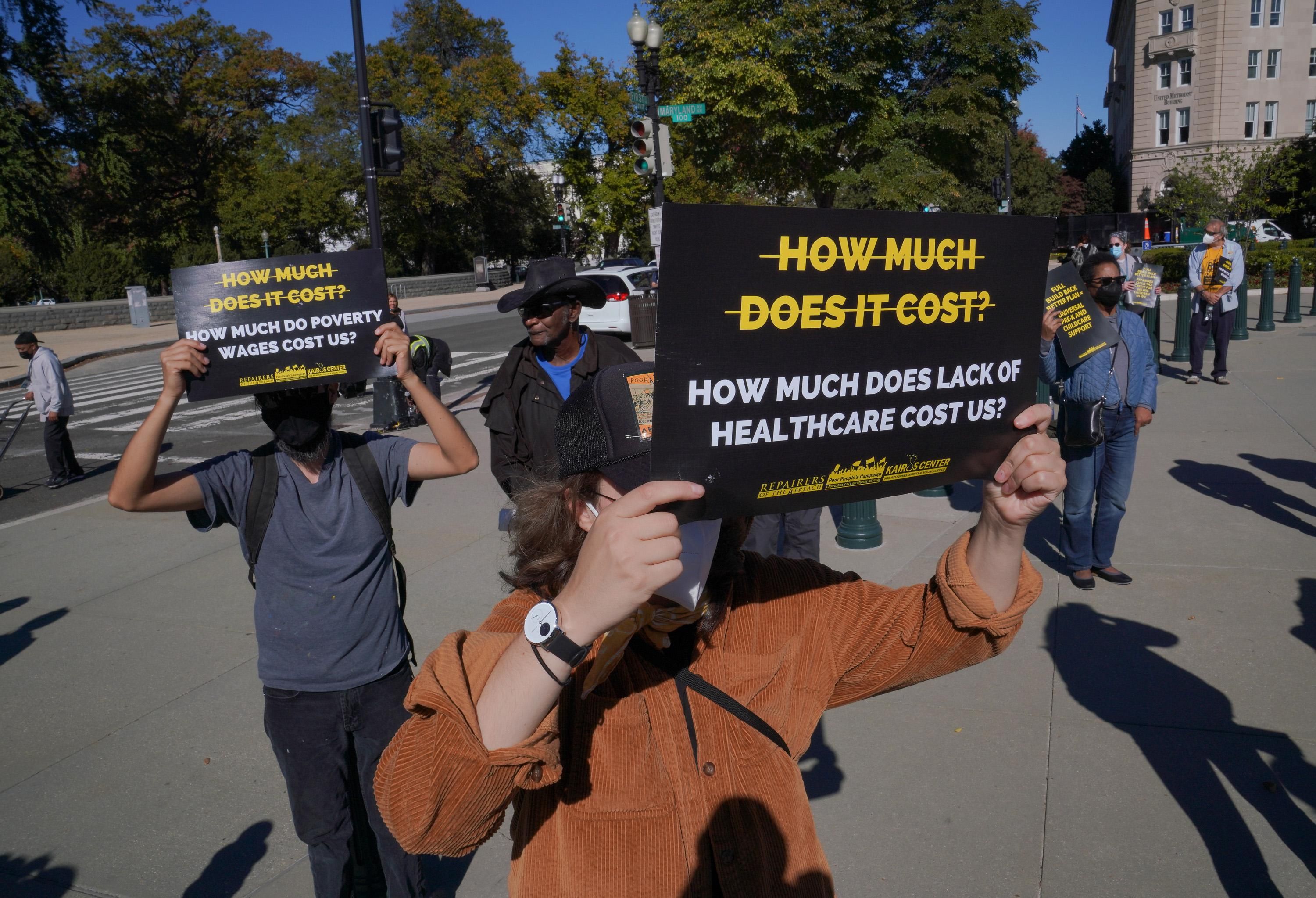 Individuals hold signs at a rally held by the Poor People's Campaign: A National Call For Moral Revival on October 27, 2021 in Washington, D.C. (Photo: Jemal Countess via Getty Images for Repairers Of The Breach)