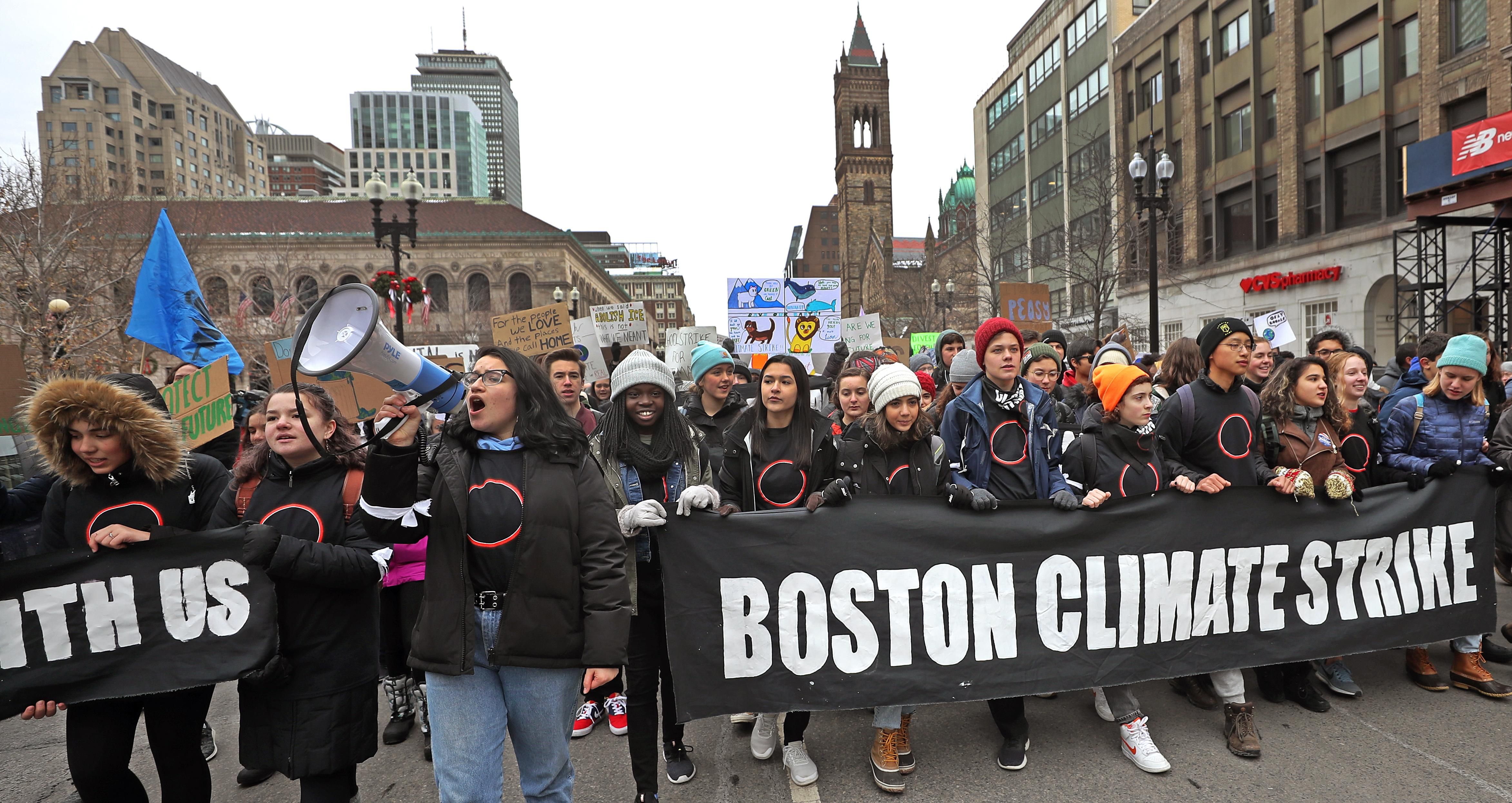 Protesters march from Copley Plaza to the Massachusetts State House in Boston to call for climate action on December 6, 2019.
