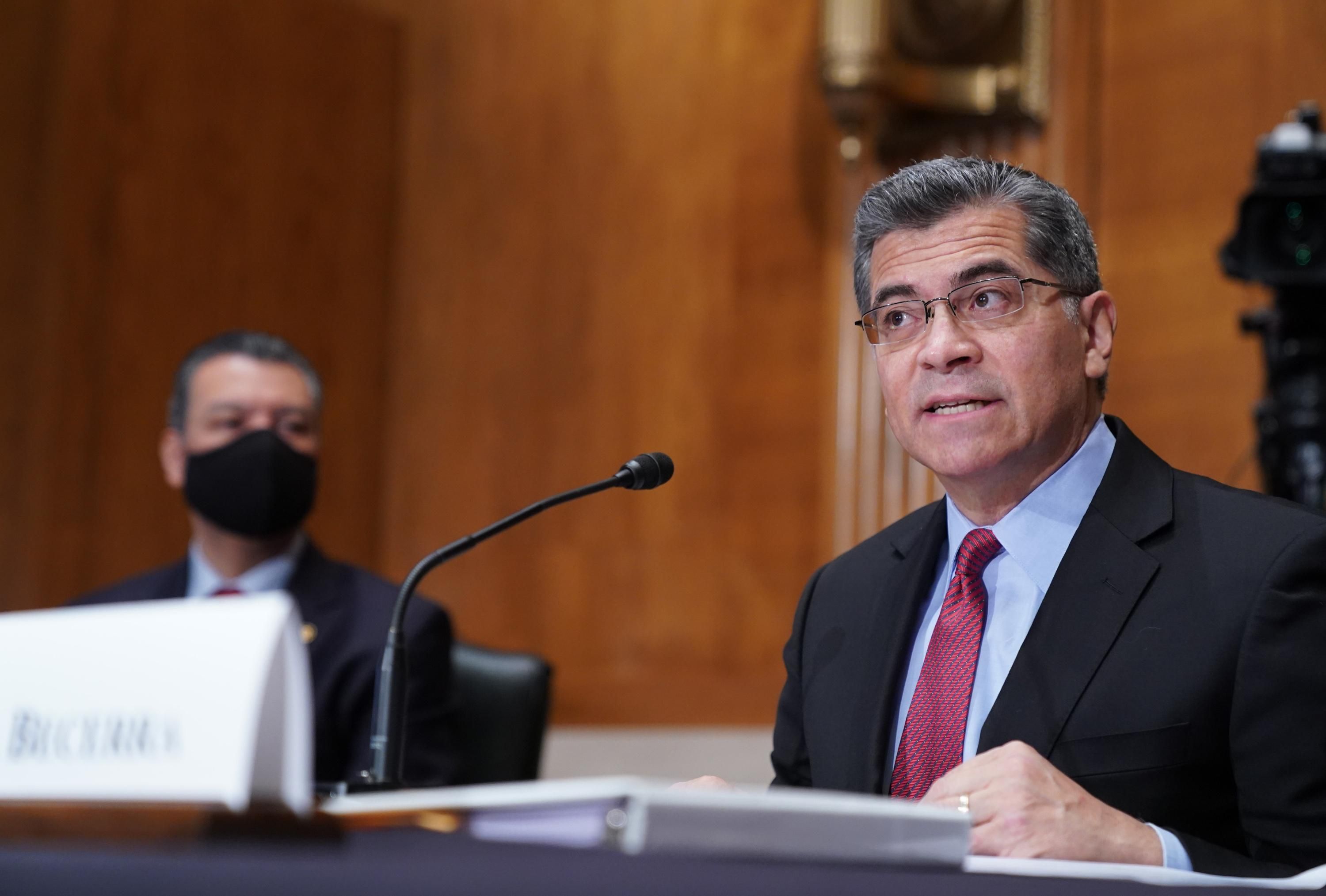 Health and Human Services Secretary Xavier Becerra speaks at a hearing.