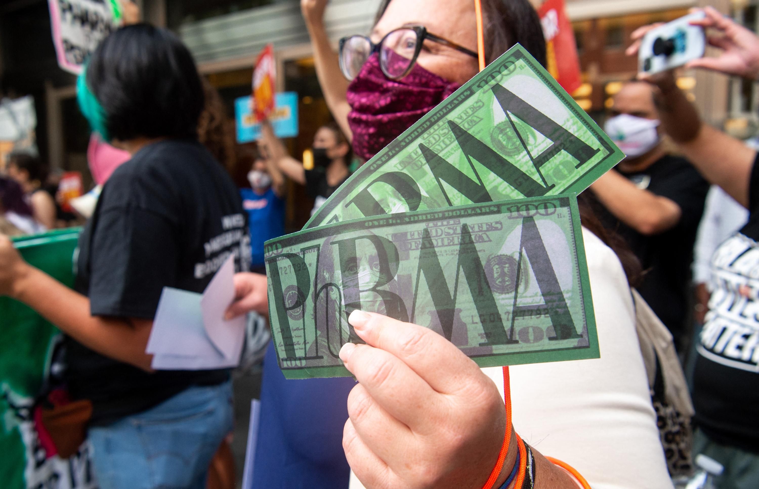Demonstrators protest outside PhRMA headquarters.