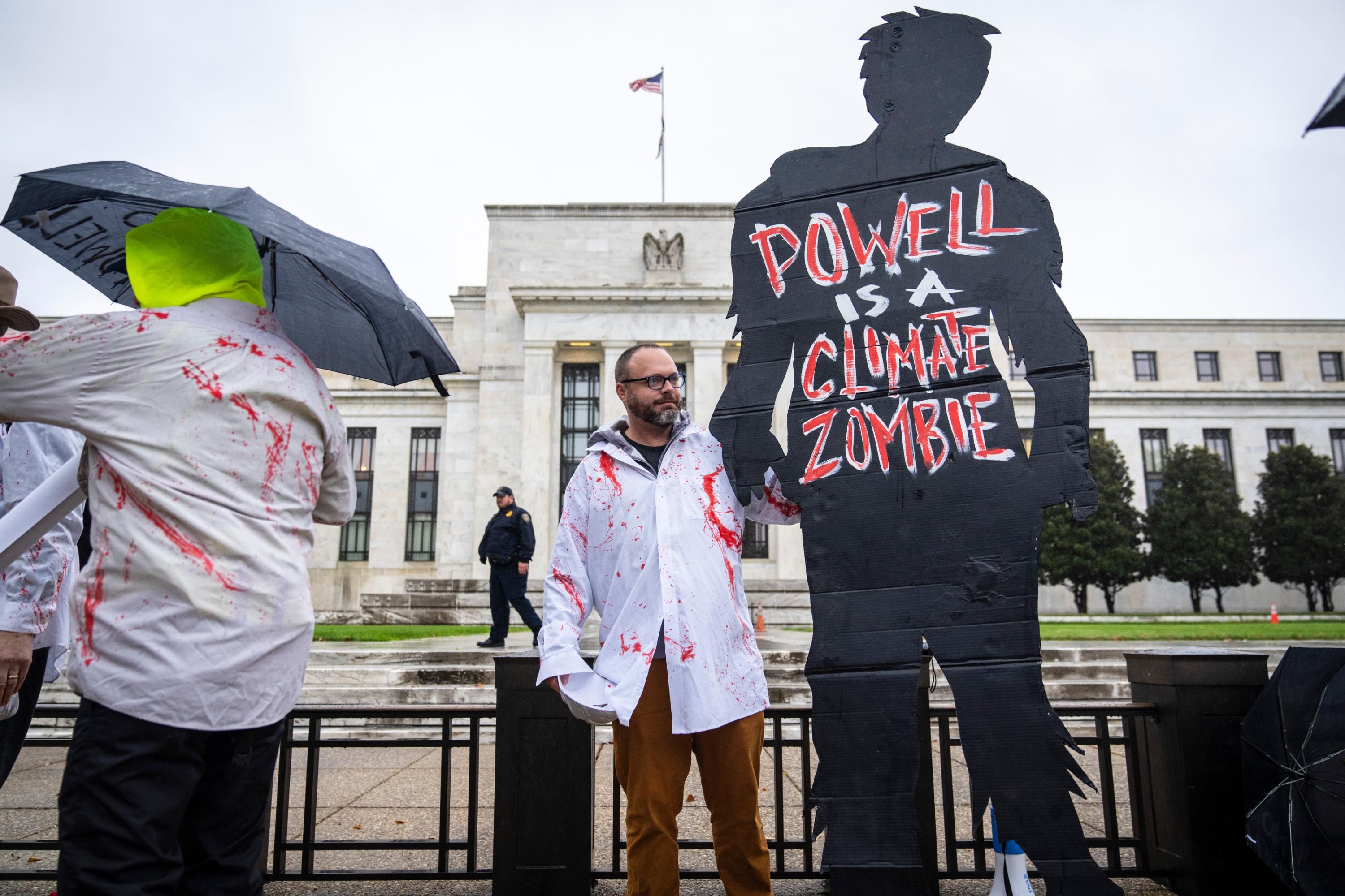 Climate activists protest Fed Chair Jerome Powell.