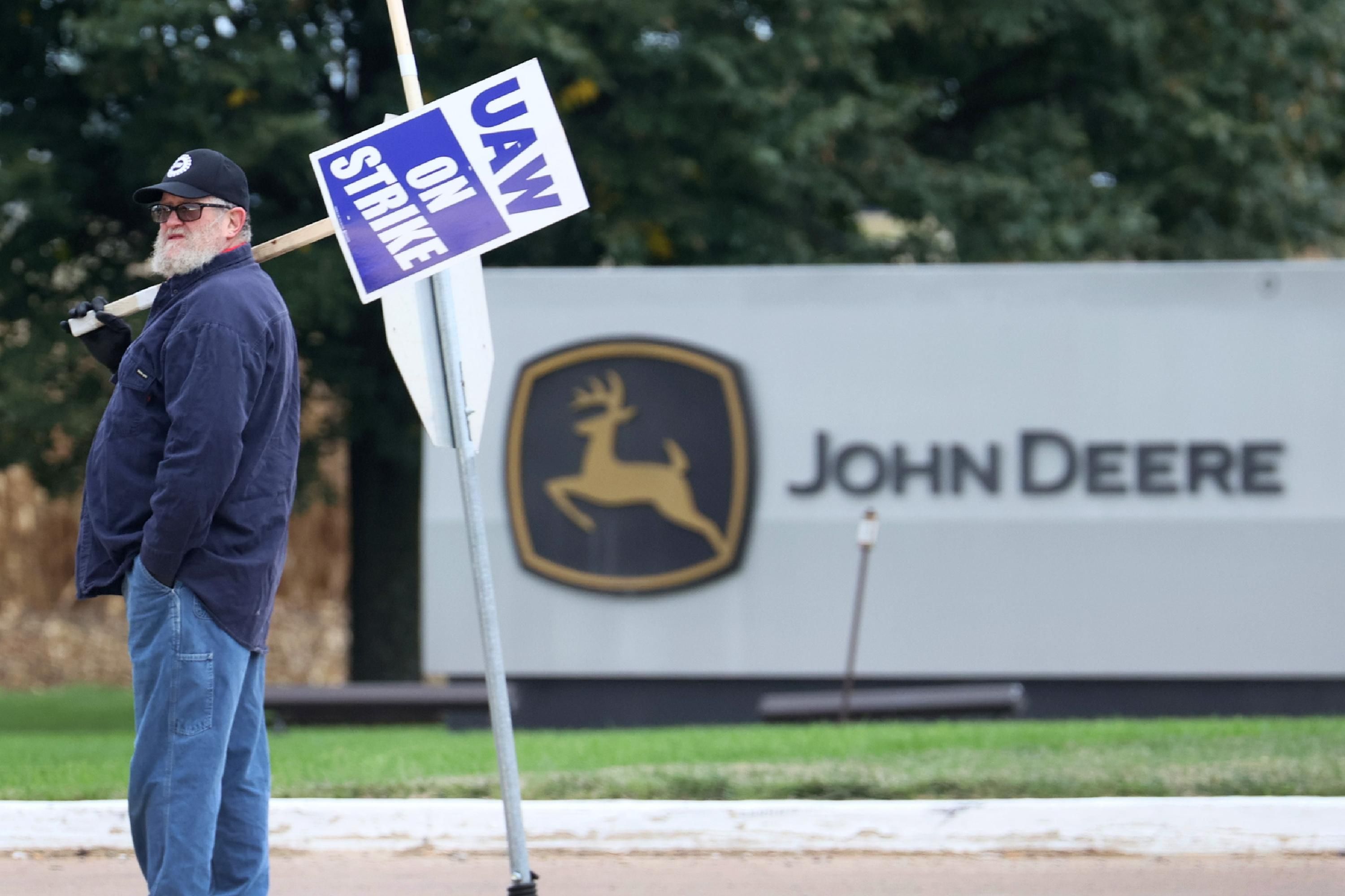John Deere worker on strike outside an Iowa facility.