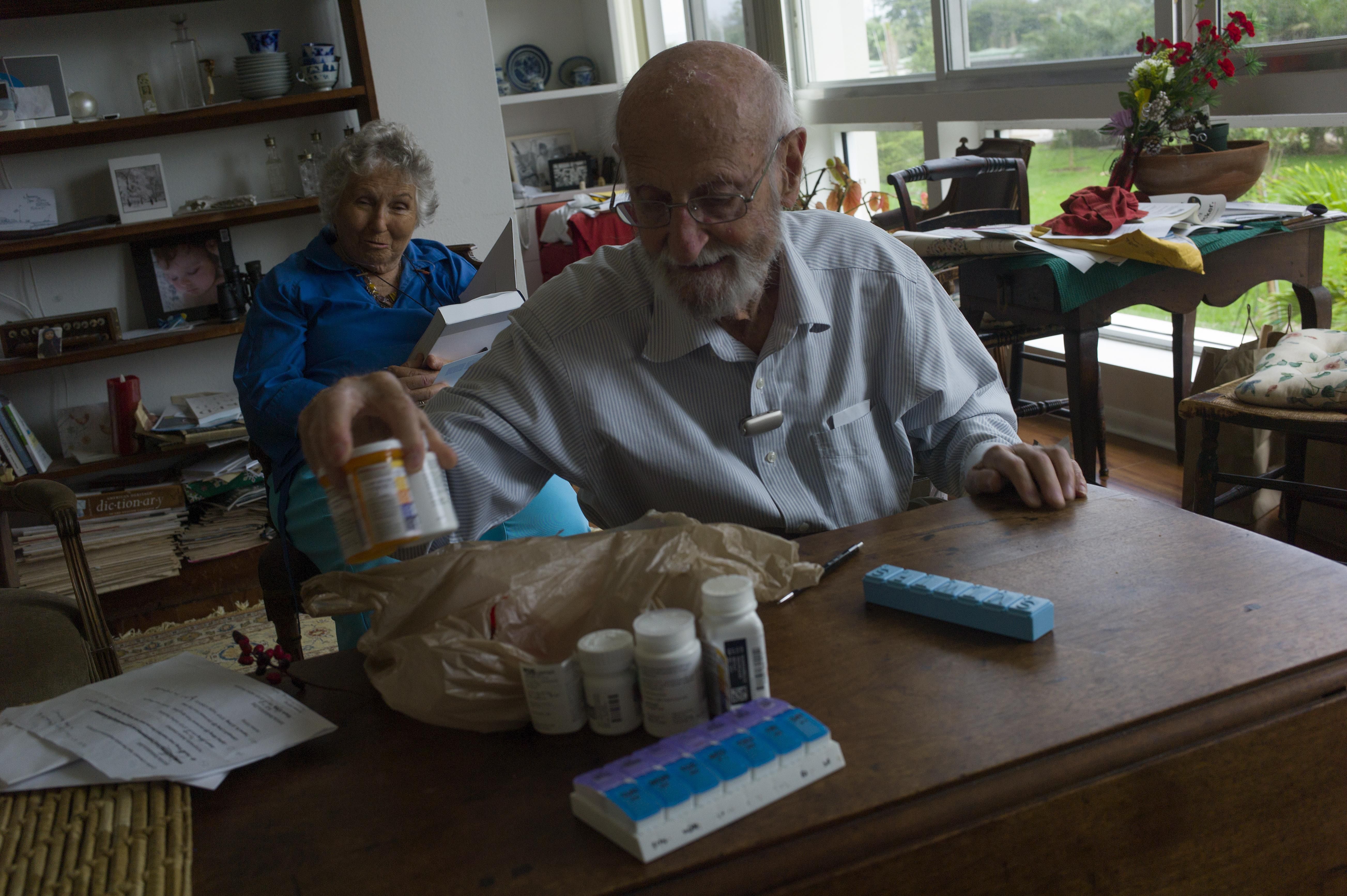 Charles Miller, 90, prepares the daily pills his wife will need for the week on January 4, 2020, in Sarasota, Florida. After suffering a stroke and heart attack, his wife needs approximately ten different medicines daily which need to be carefully monitored. (Photo: Andrew Lichtenstein/Corbis via Getty Images)