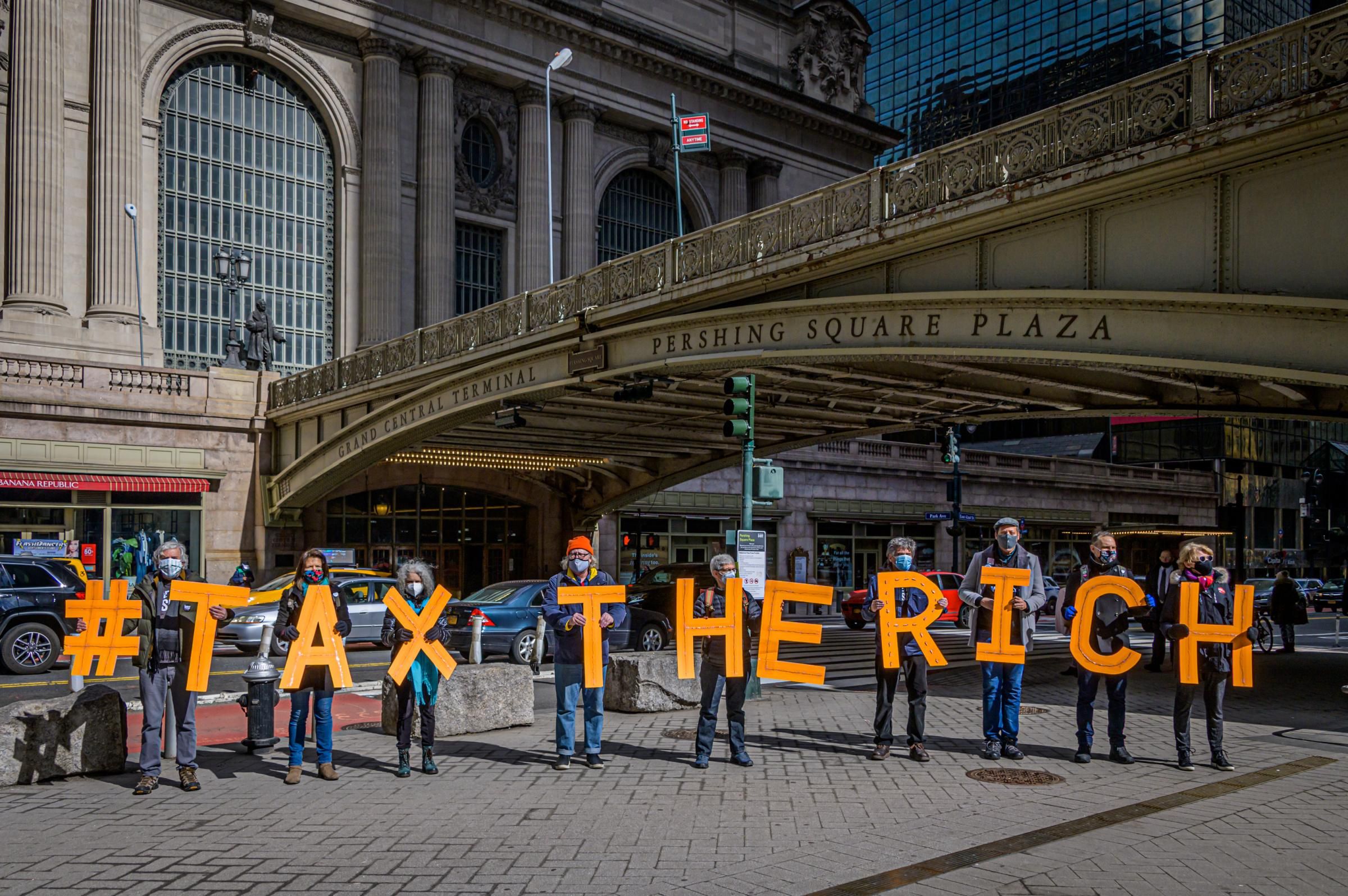 Activists spell out #TaxTheRich at Grand Central Station in New York City on March 4, 2021. (Photo: Erik McGregor/LightRocket via Getty Images)
