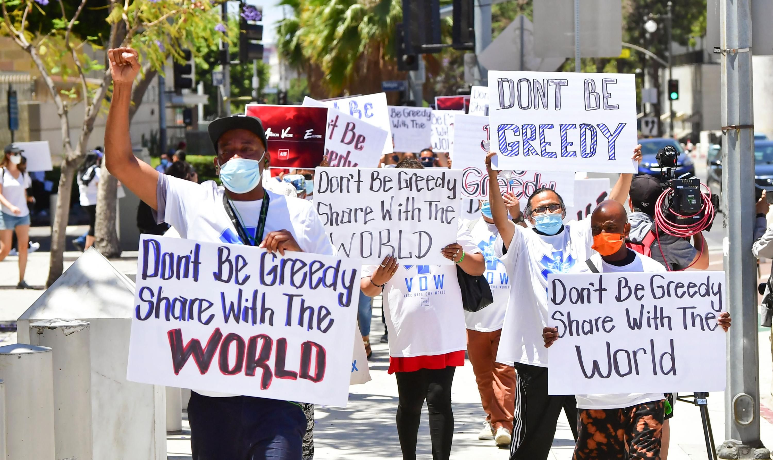 Demonstrators march against vaccine inequity
