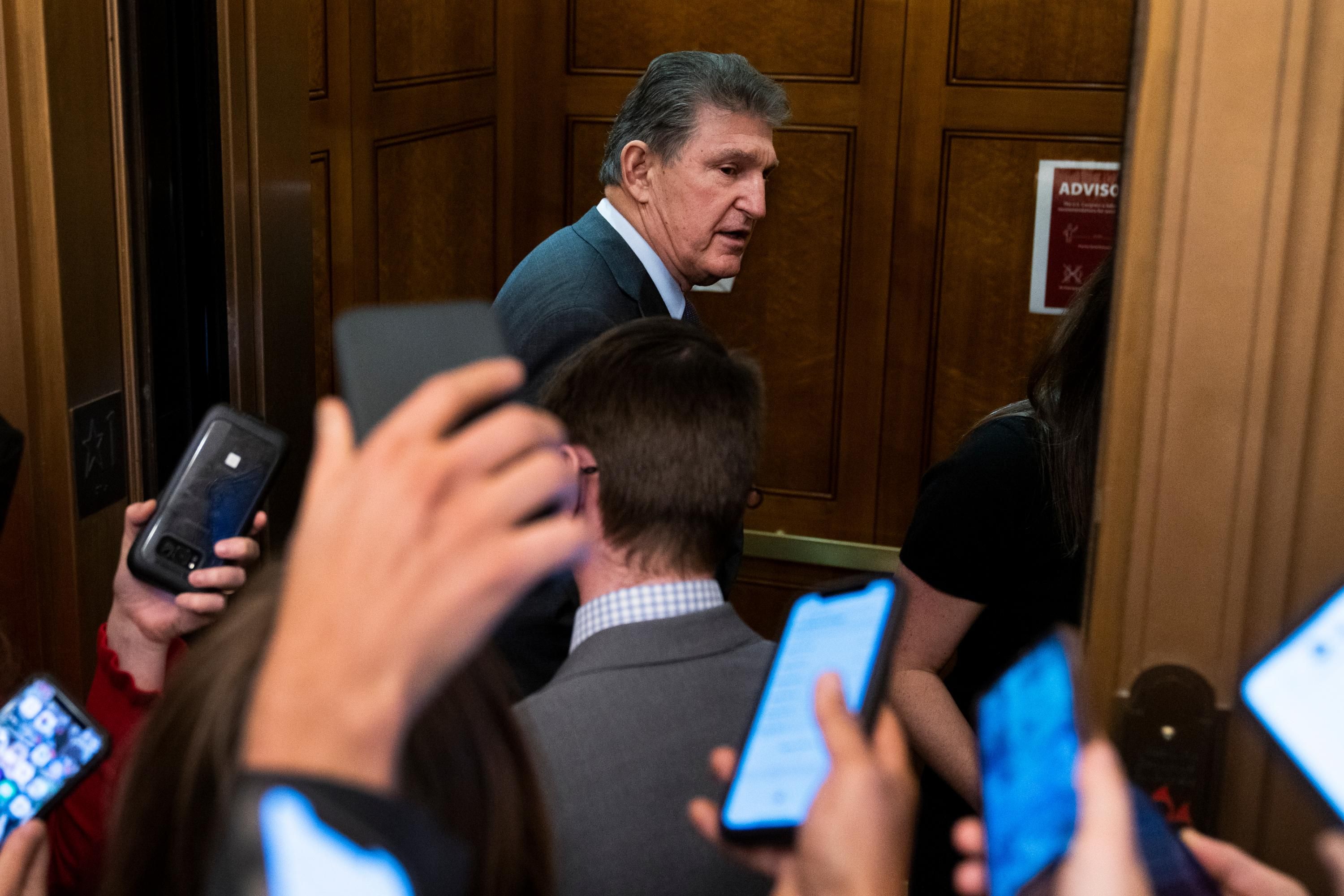 Sen. Joe Manchin enters an elevator