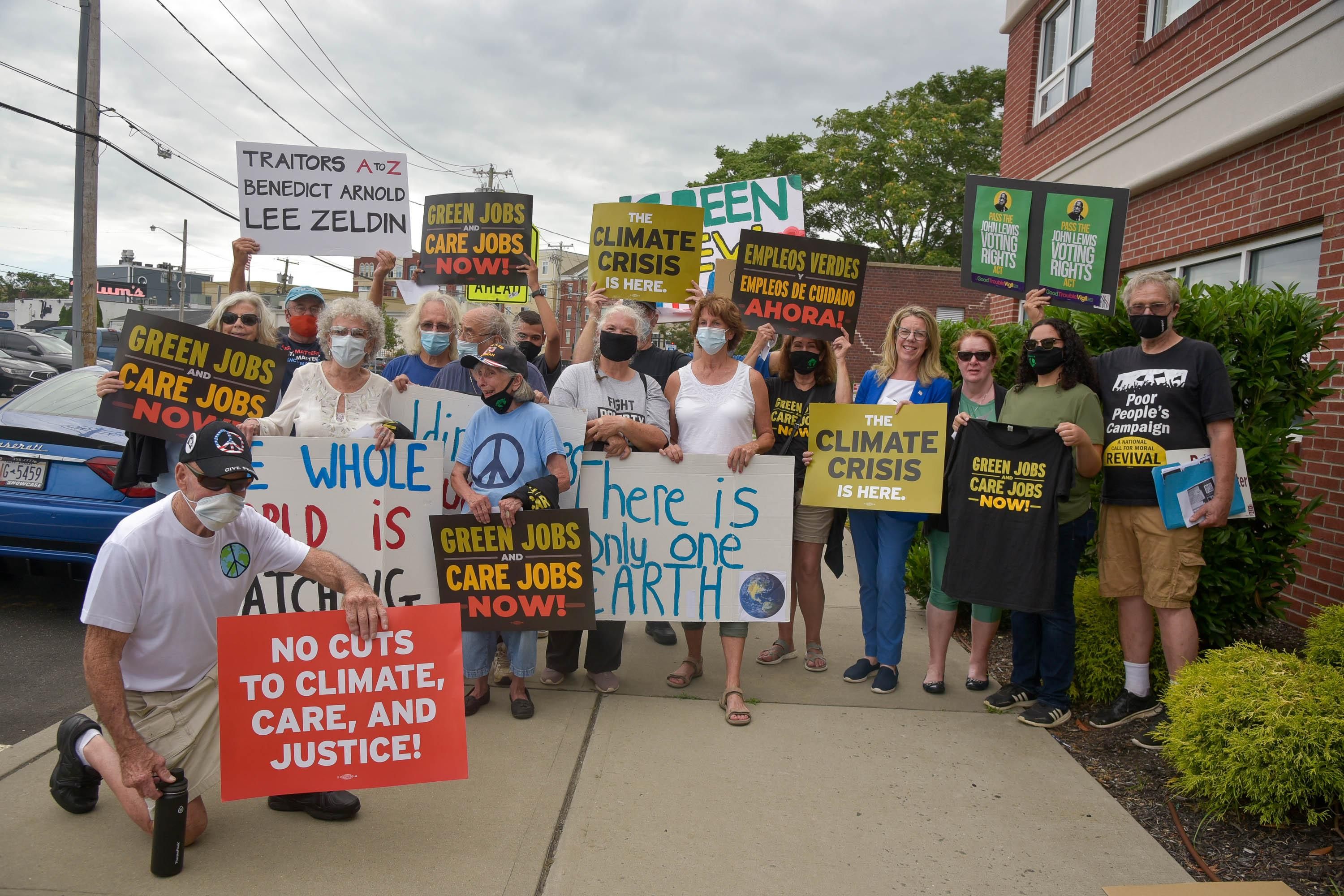 Activists attend the Rally to #SealTheDeal for Climate, Jobs, Care, and Justice on August 19, 2021 in Patchogue, New York