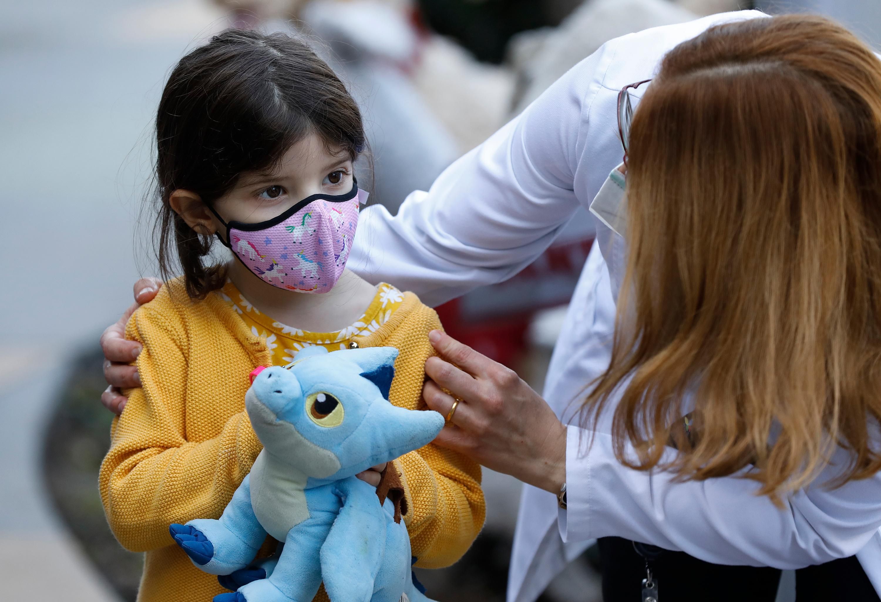 A child gets a Covid-19 vaccine dose