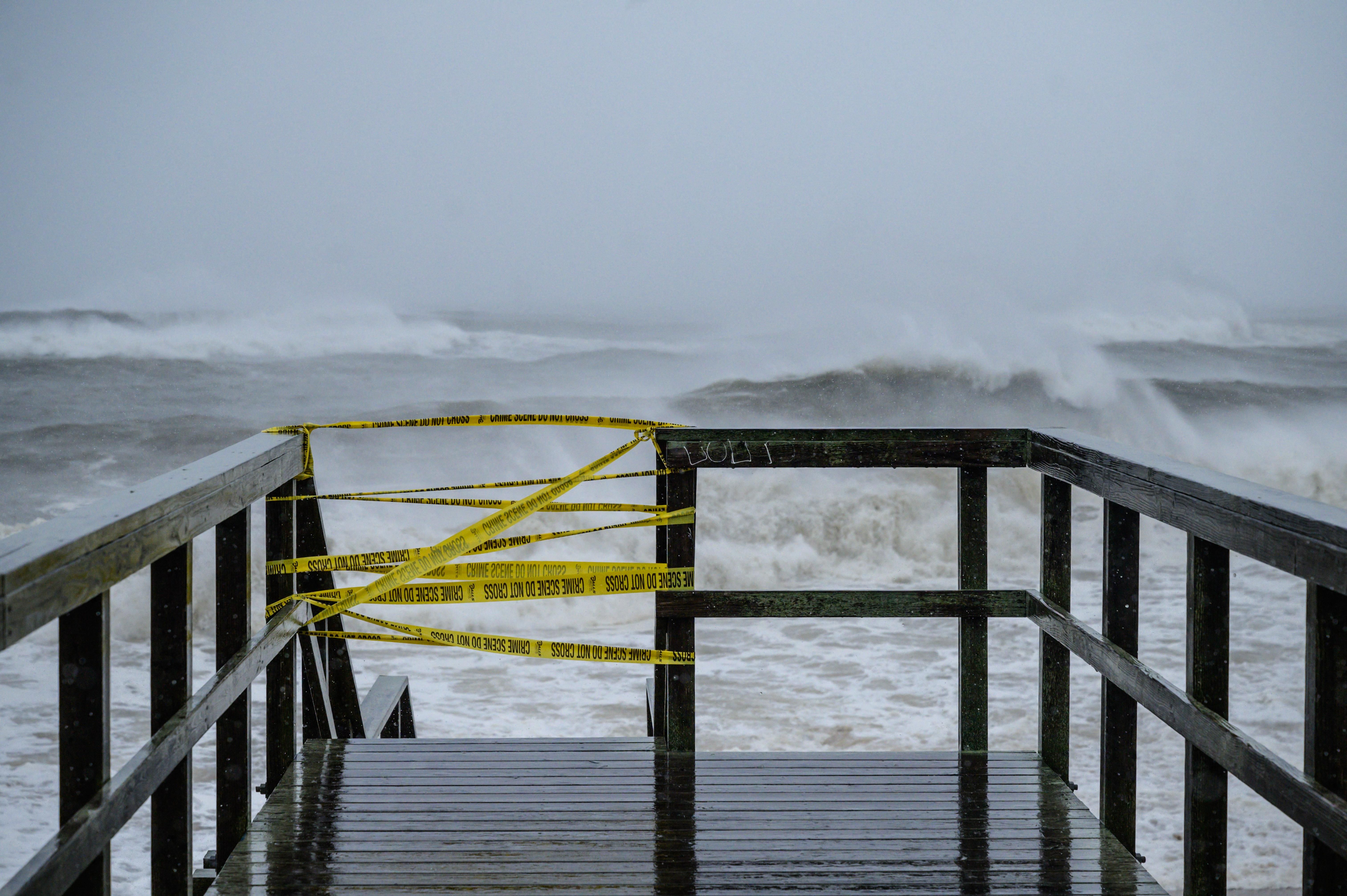 A beach access point is closed as waves from Tropical Storm Henri approach Long Island, New York on August 22, 2021.