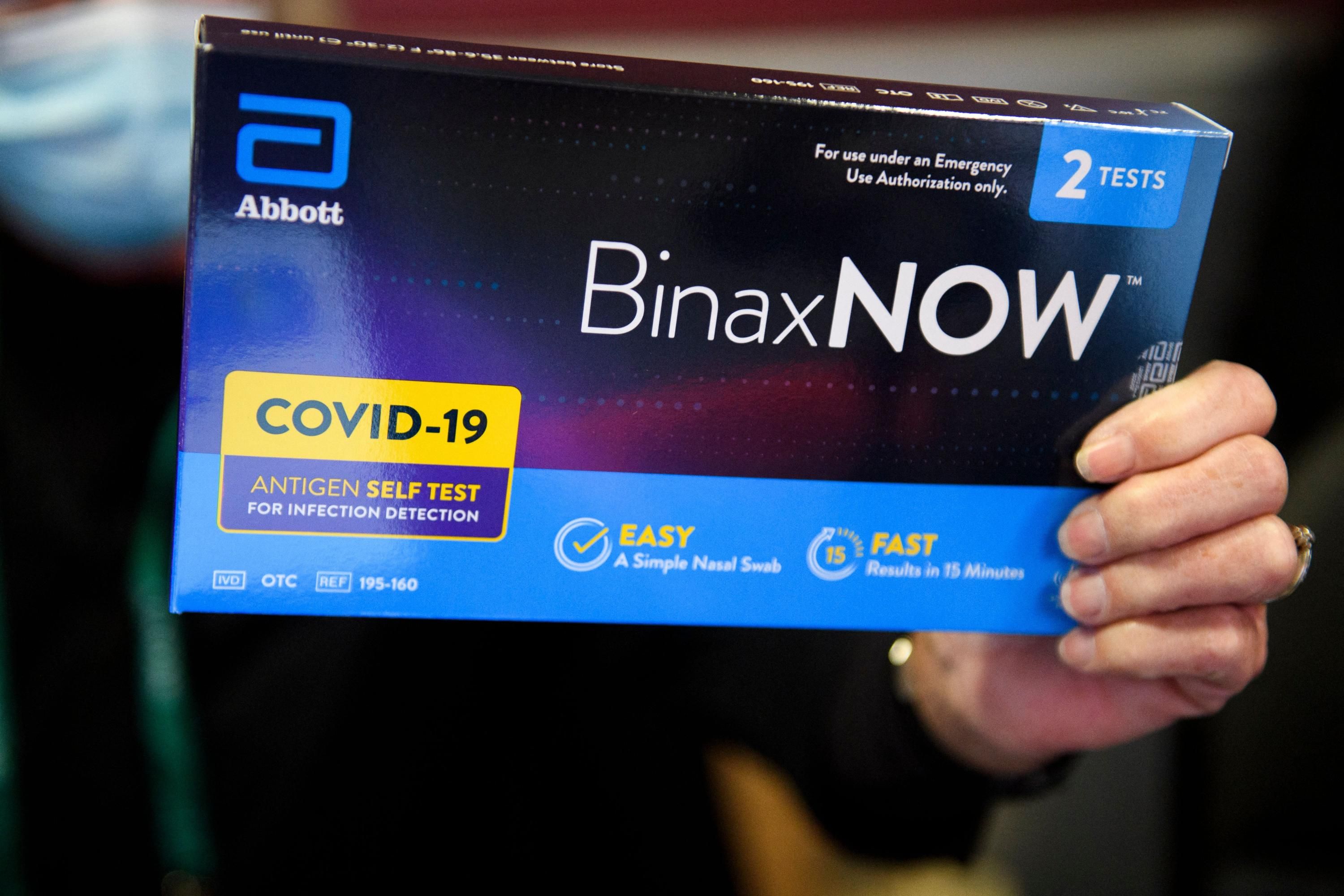 A Covid-19 test is displayed for a photograph