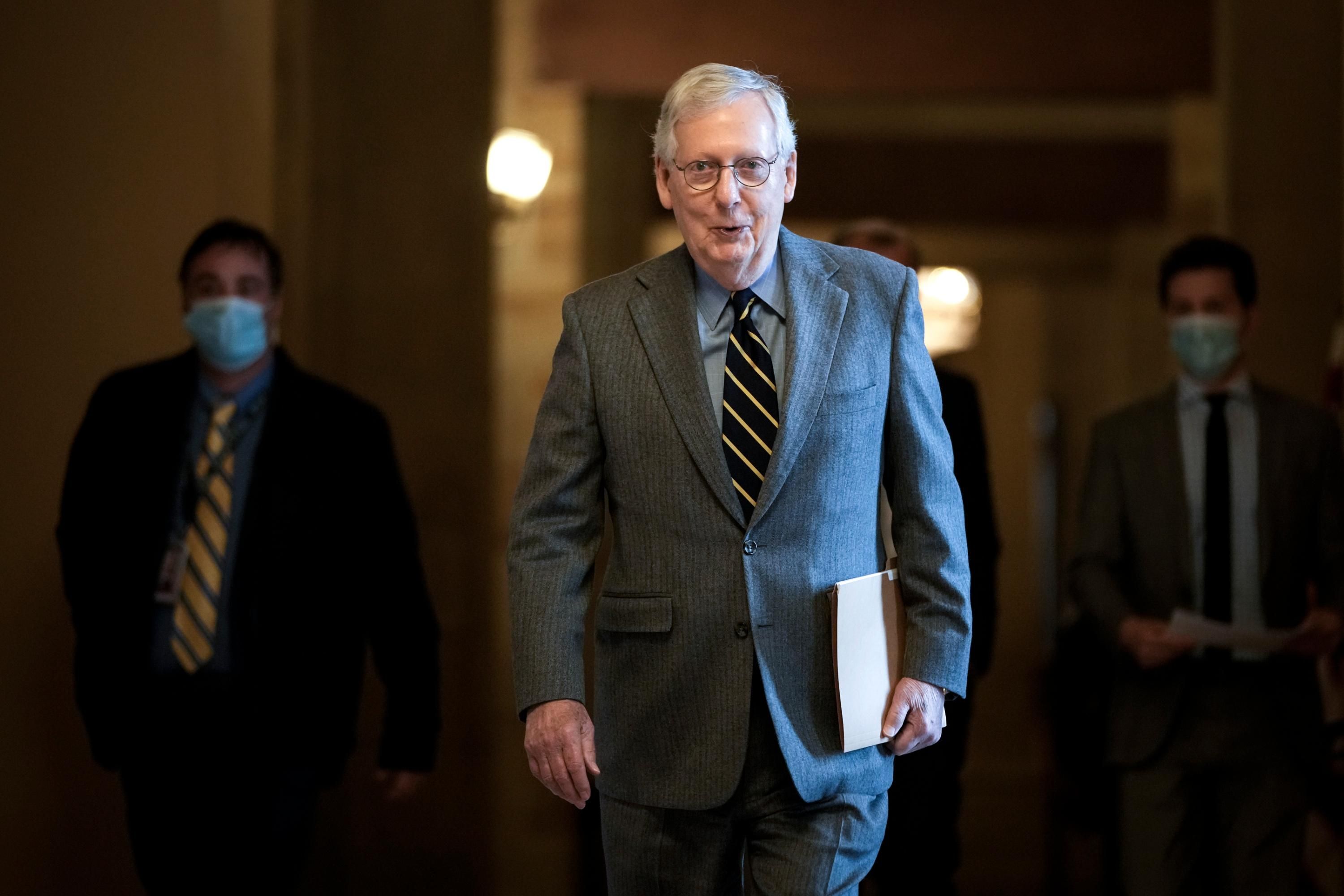 Senate Minority Leader Mitch McConnell walks in the U.S. Capitol