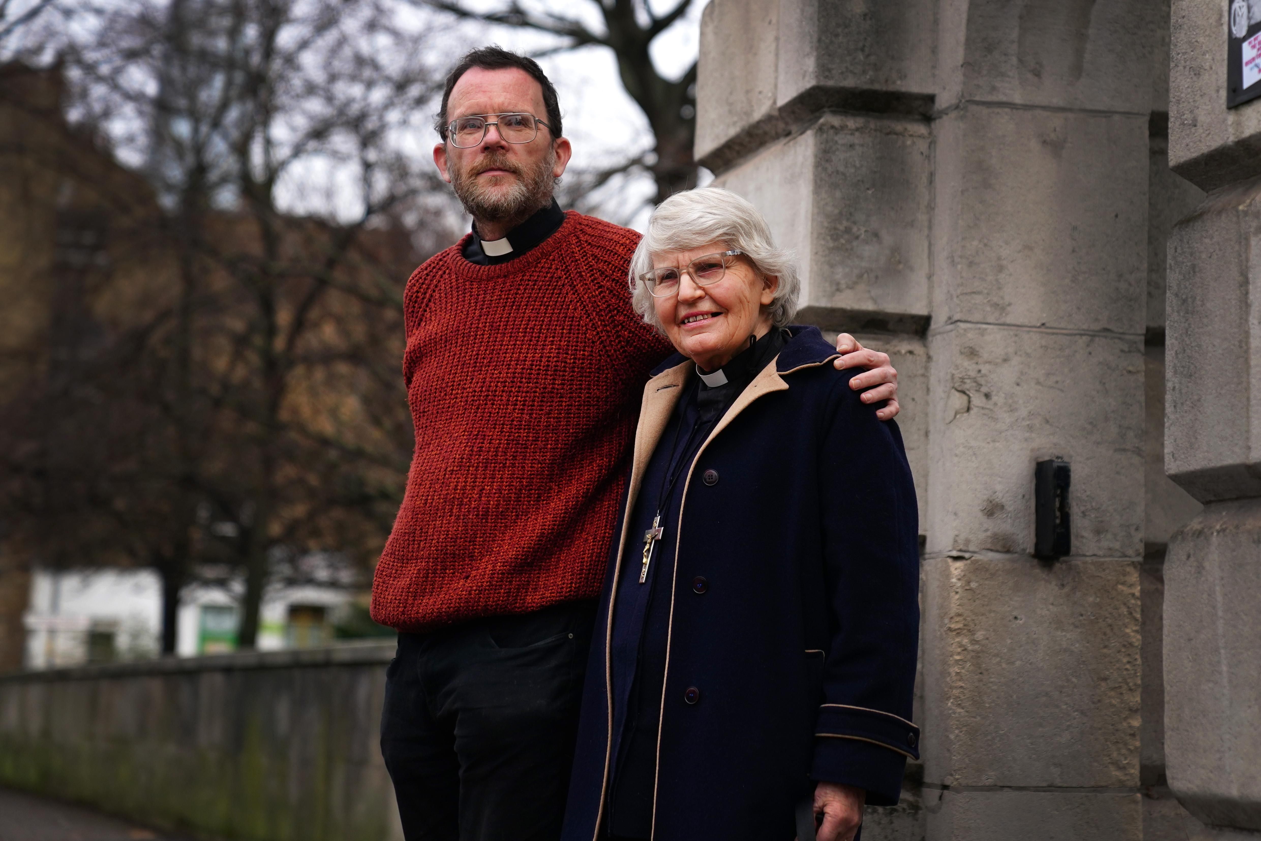 Extinction Rebellion activists Father Martin Newell and Reverend Sue Parfitt stand outside Inner London Crown Court on January 10, 2022.