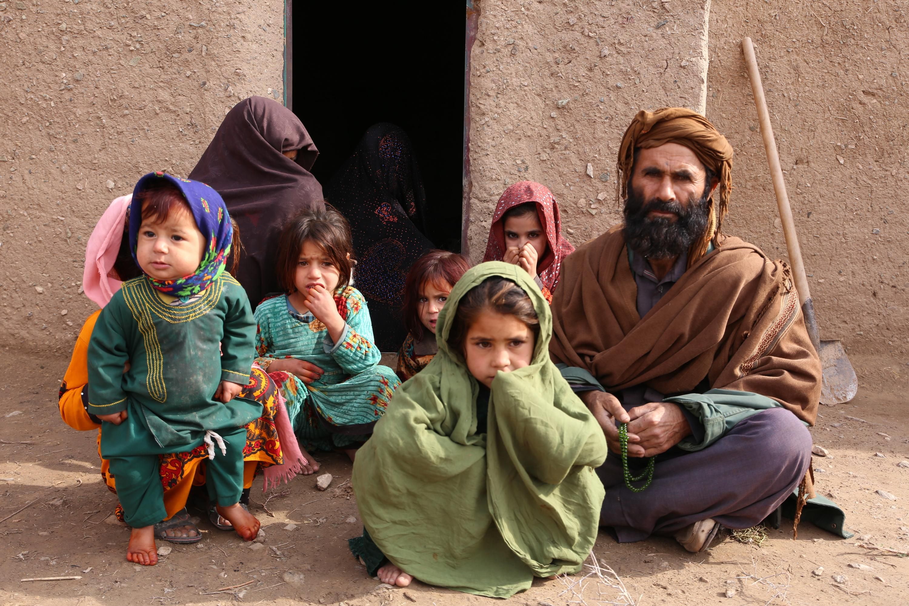 An Afghan father with his children