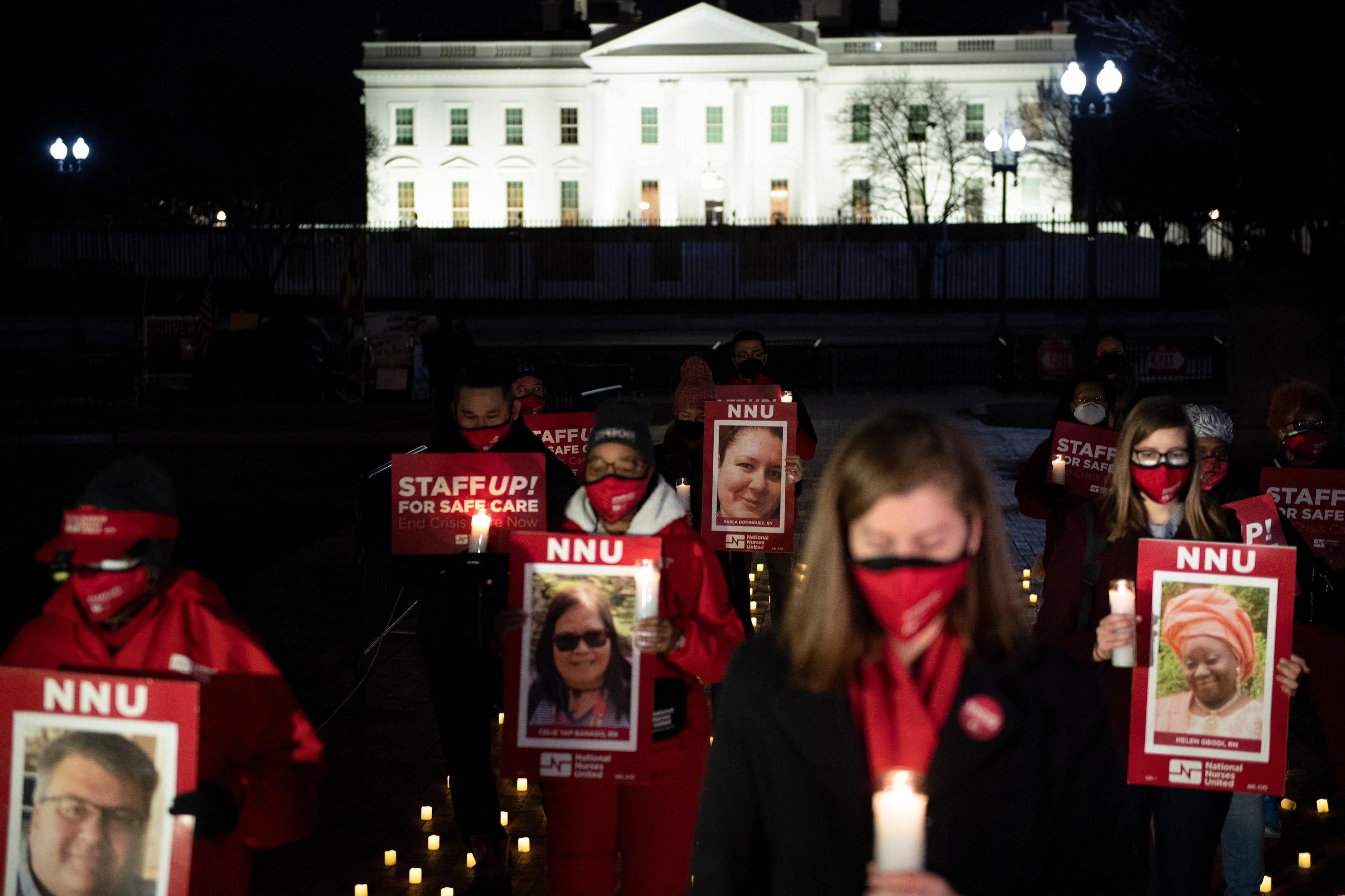 Nurses hold a vigil outside of the White House