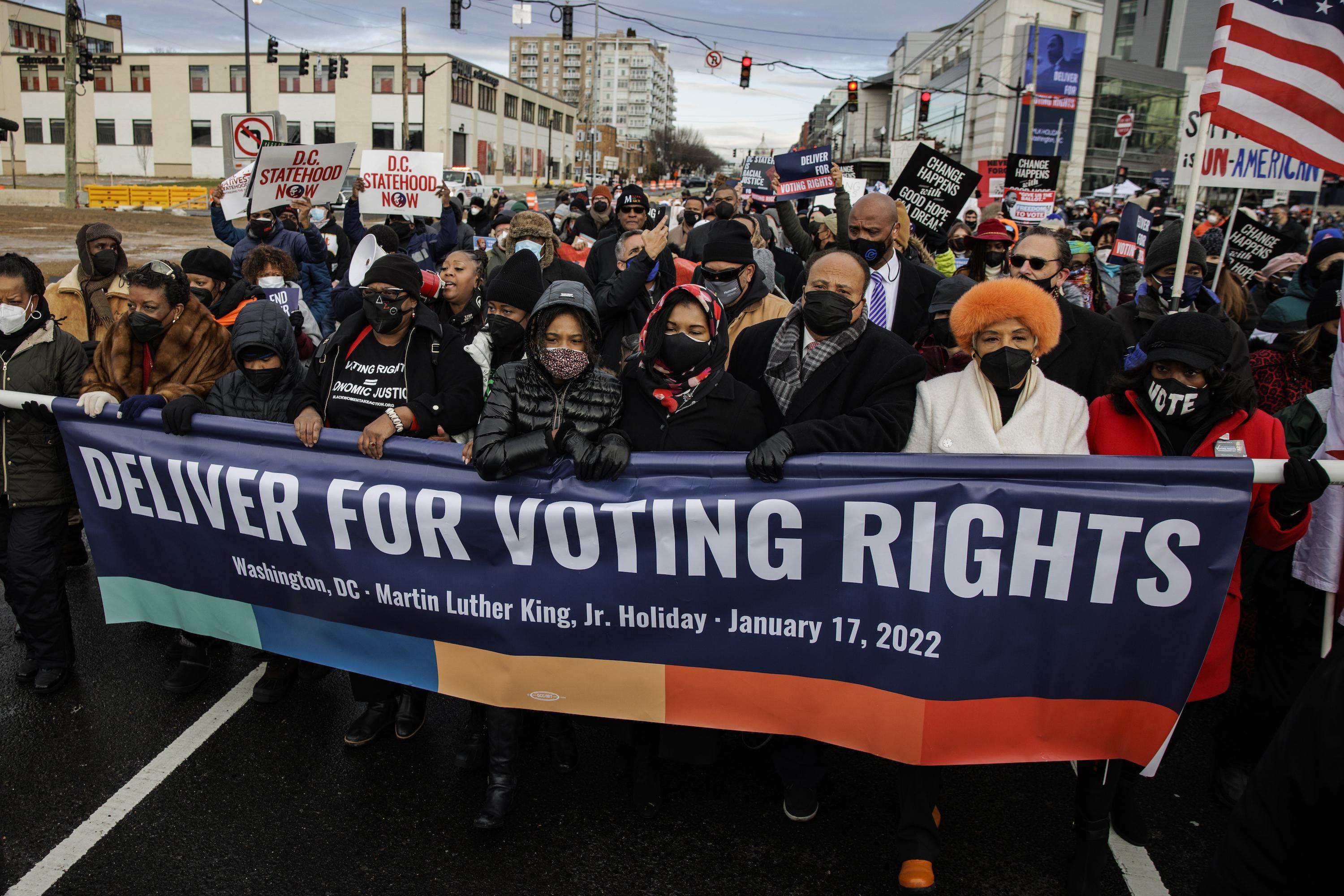 Yolanda Renee King, Arndrea Waters King, and Martin Luther King III lead the annual D.C. Peace Walk: Change Happens with Good Hope and a Dream across the Frederick Douglass Memorial Bridge for Dr. Martin Luther King Day on January 17, 2022 in Washington, D.C.