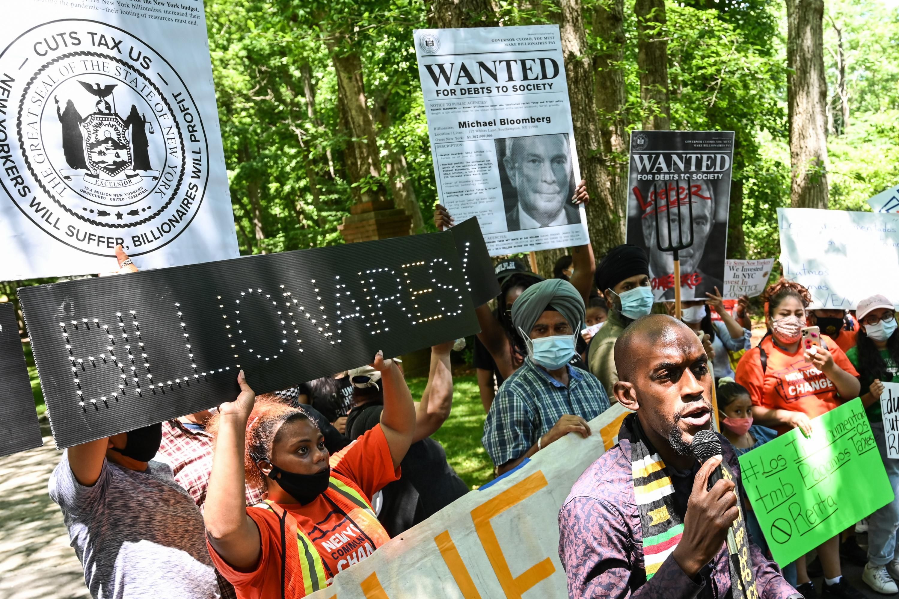 Demonstrators protest outside of Michael Bloomberg's home