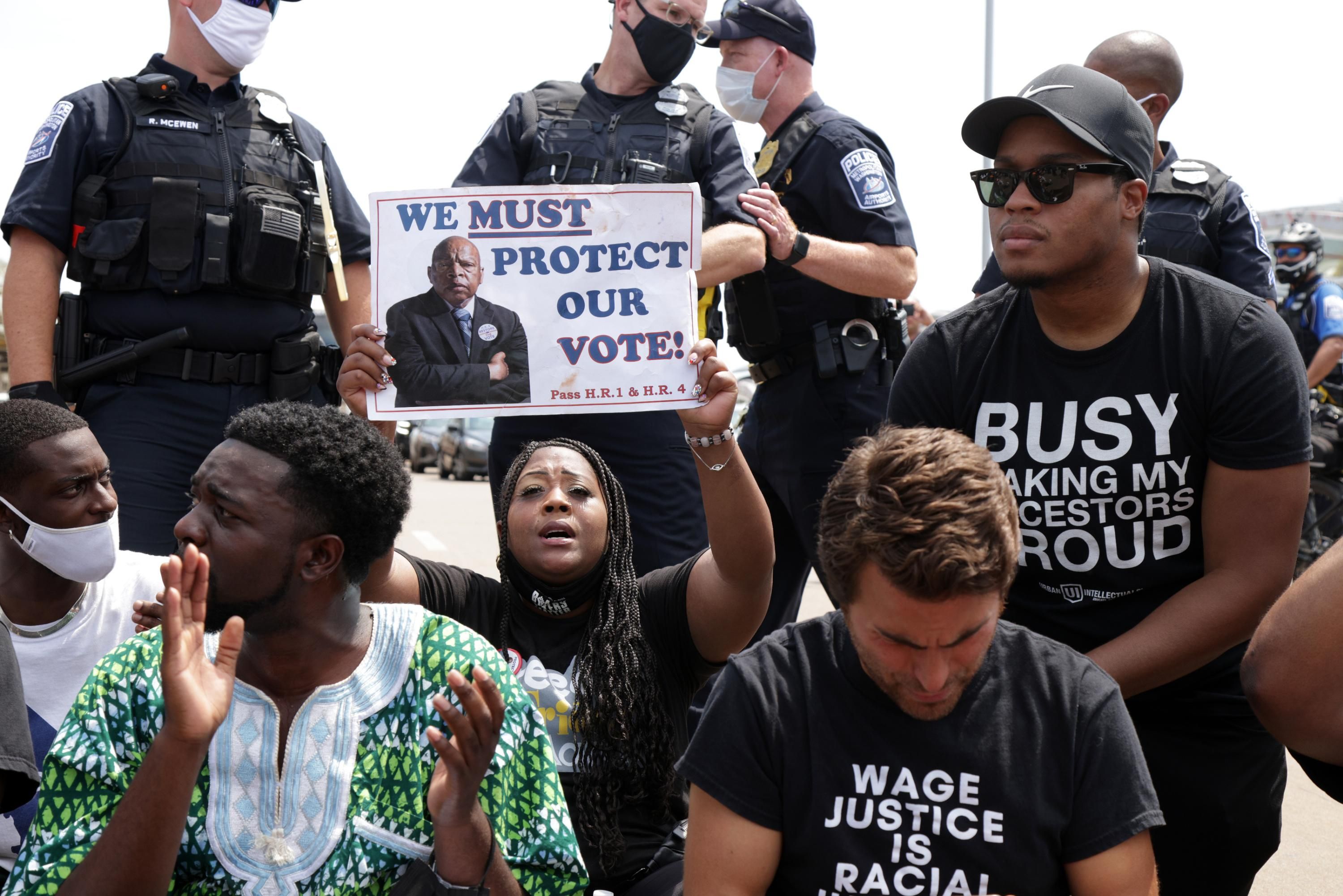 Voting rights advocates attend a protest