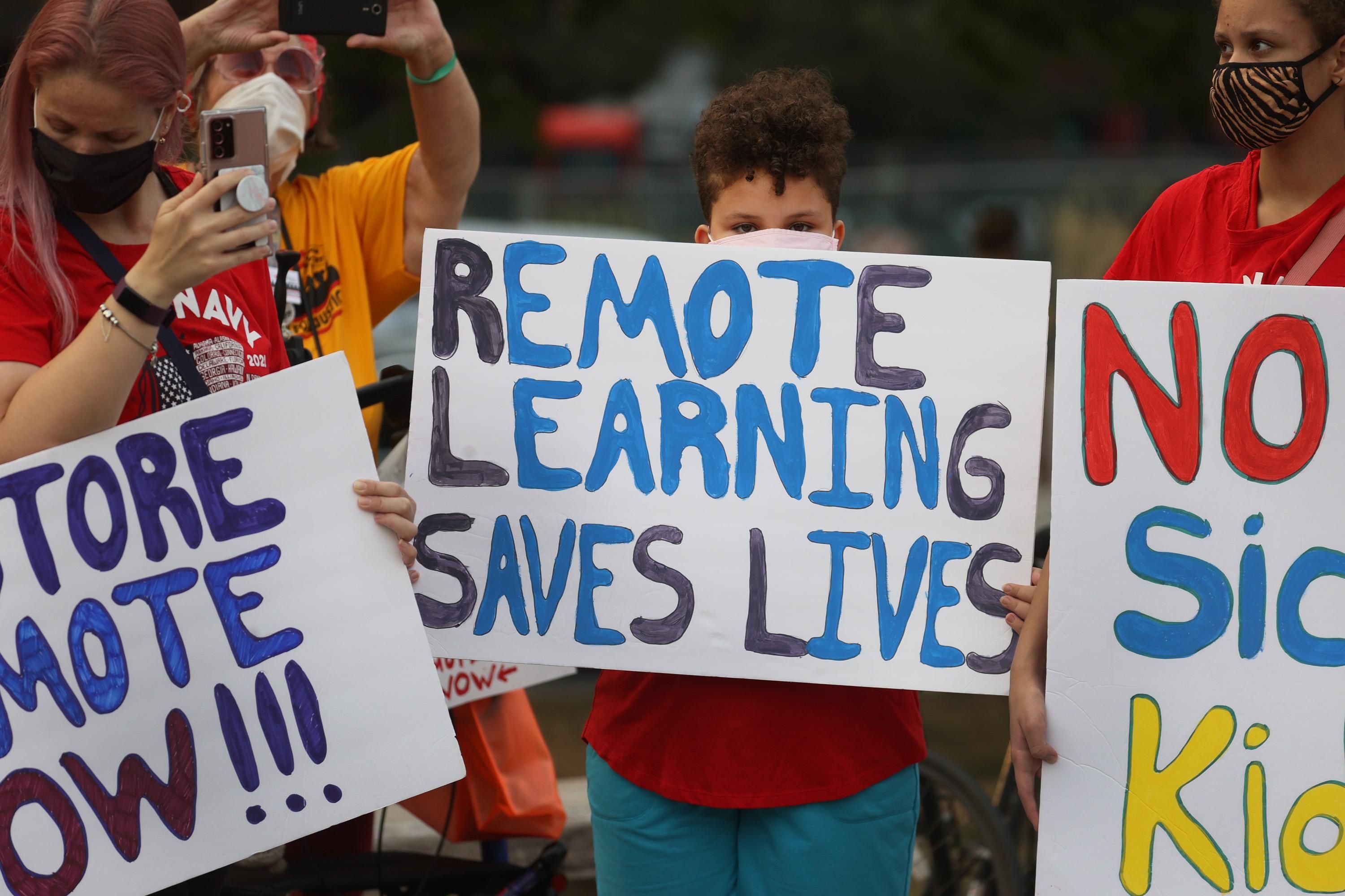 "Remote learning saves lives" sign