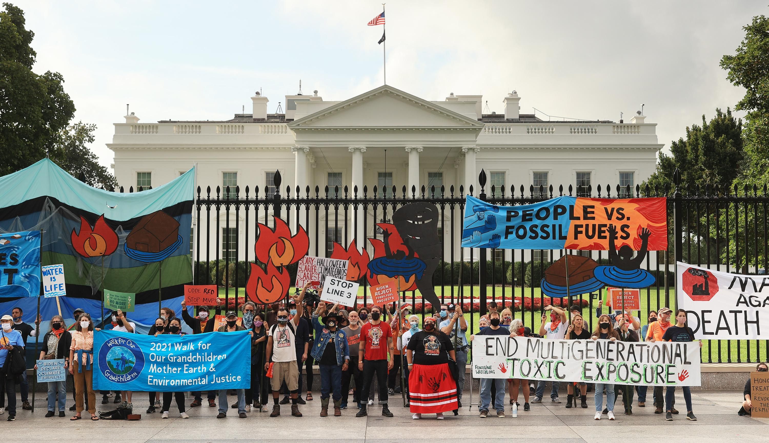 Demonstrators gather for a climate protest outside of the White House
