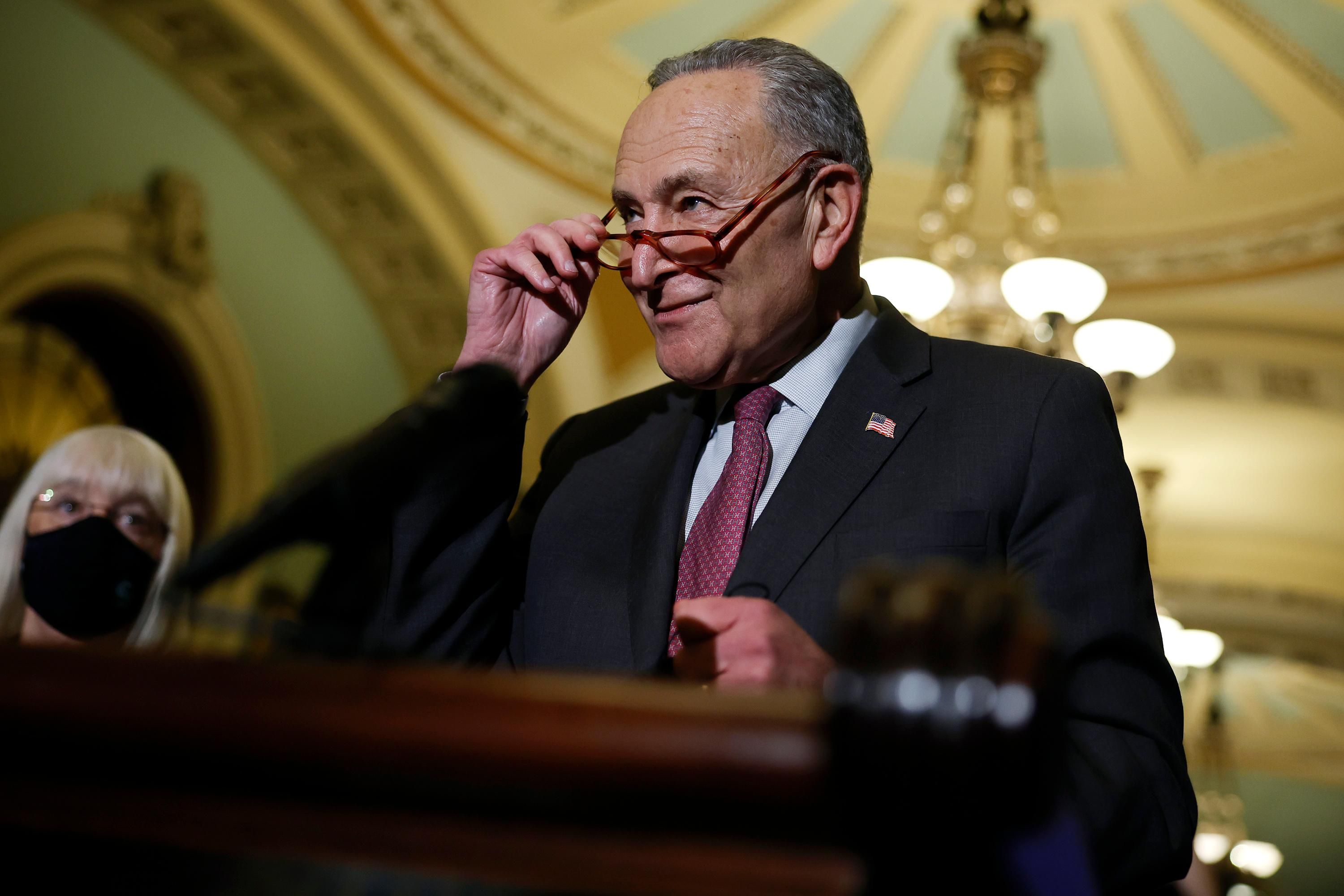 Senate Majority Leader Chuck Schumer speaks to reporters