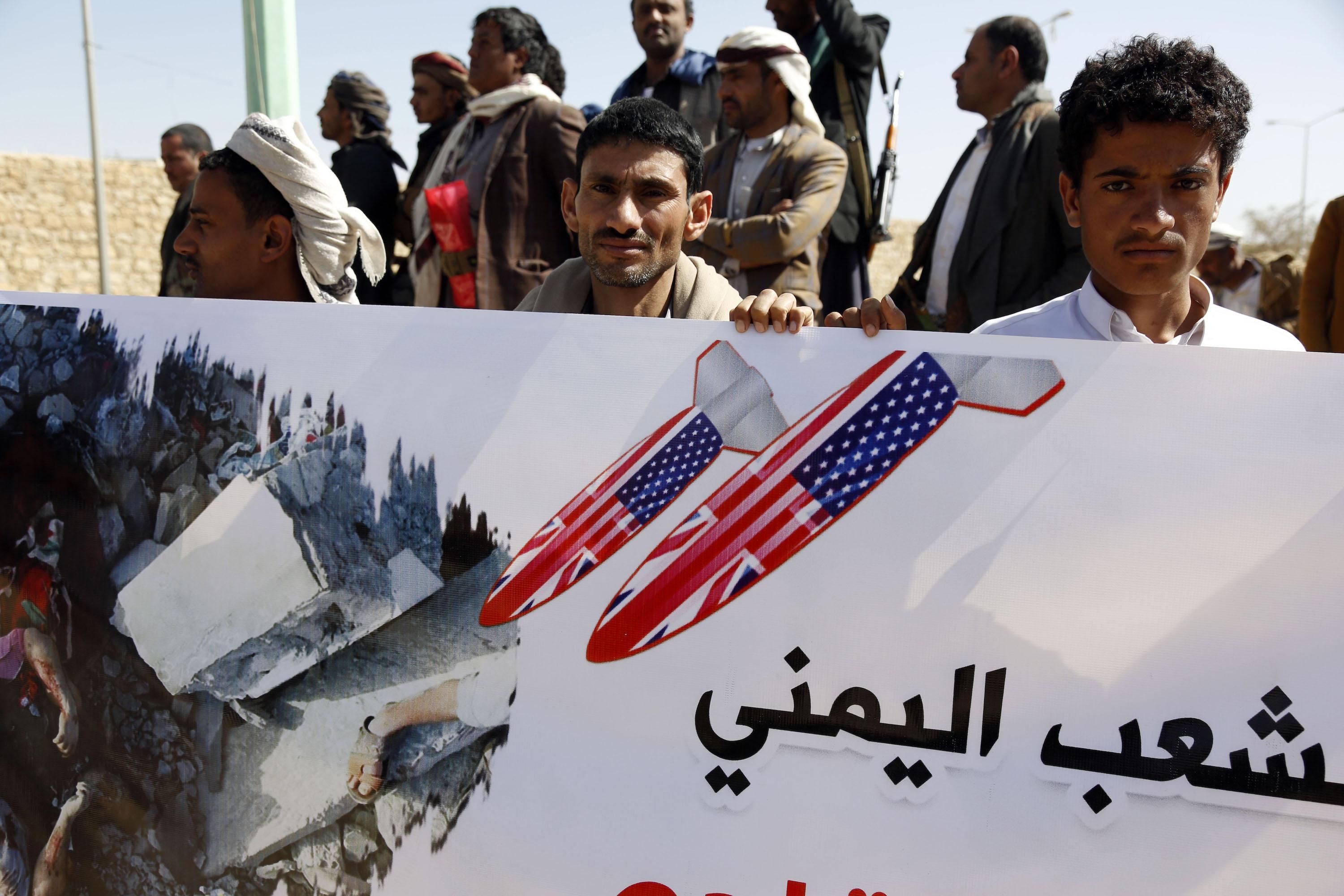 People protest the aerial attacks carried out by jet crafts of the coalition led by Saudi Arabia targeting a prison in the Houthi strong-hold Saadah Province, on January 22, 2022 in Sa'ada, Yemen. 