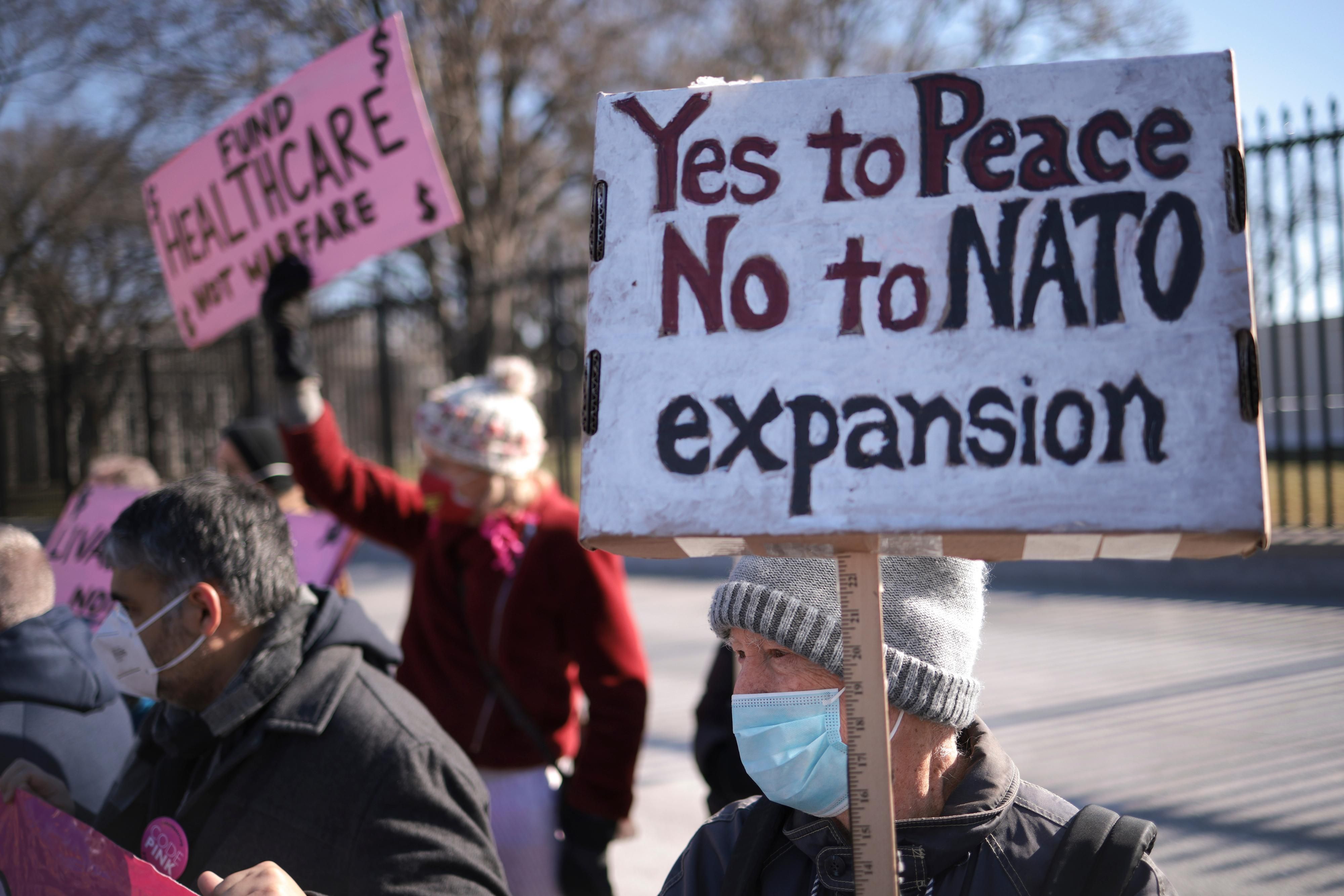 Anti-war protesters outside the White House urging against escalation with Russia