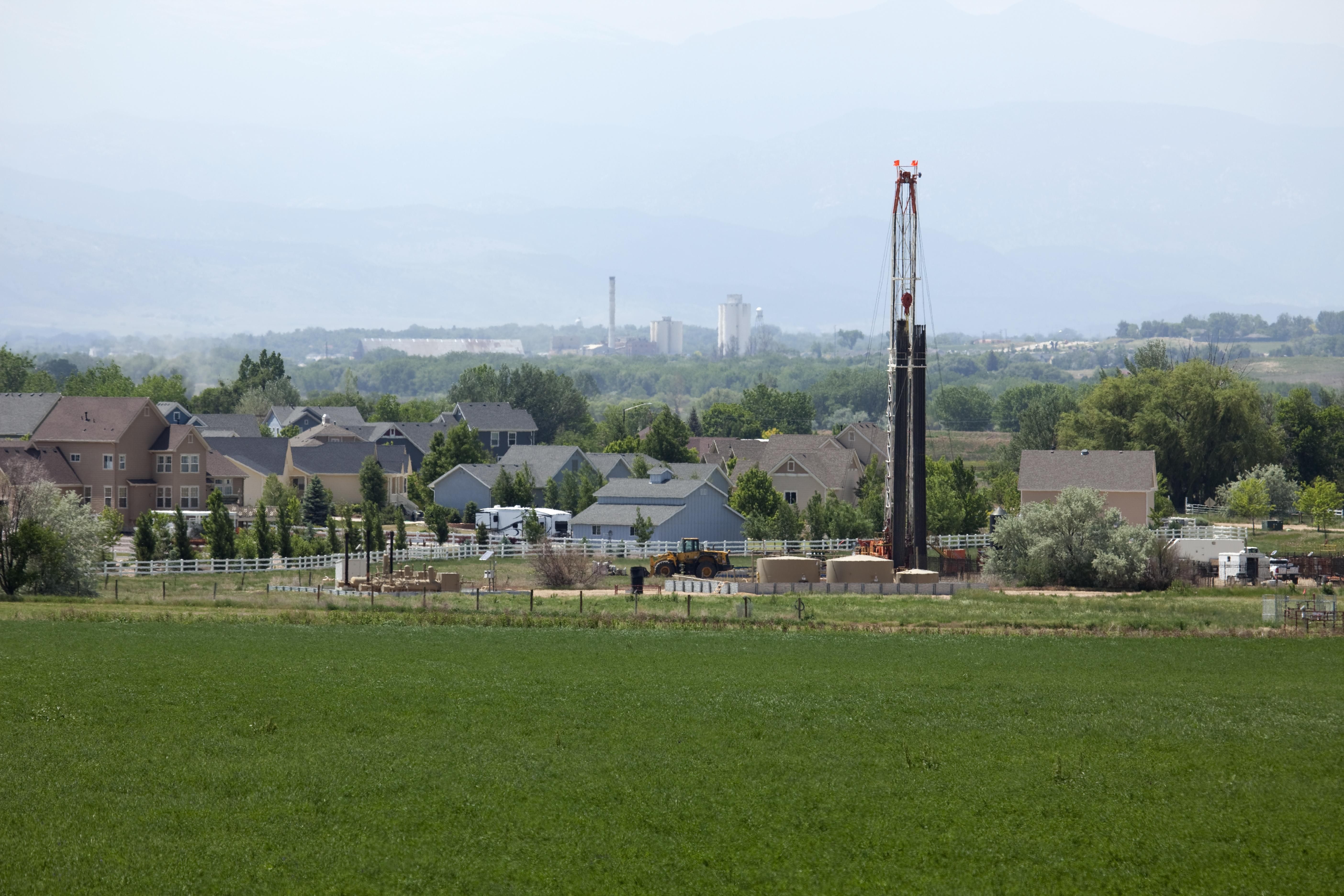 A drill rig operates near homes in Frederick, Colorado.