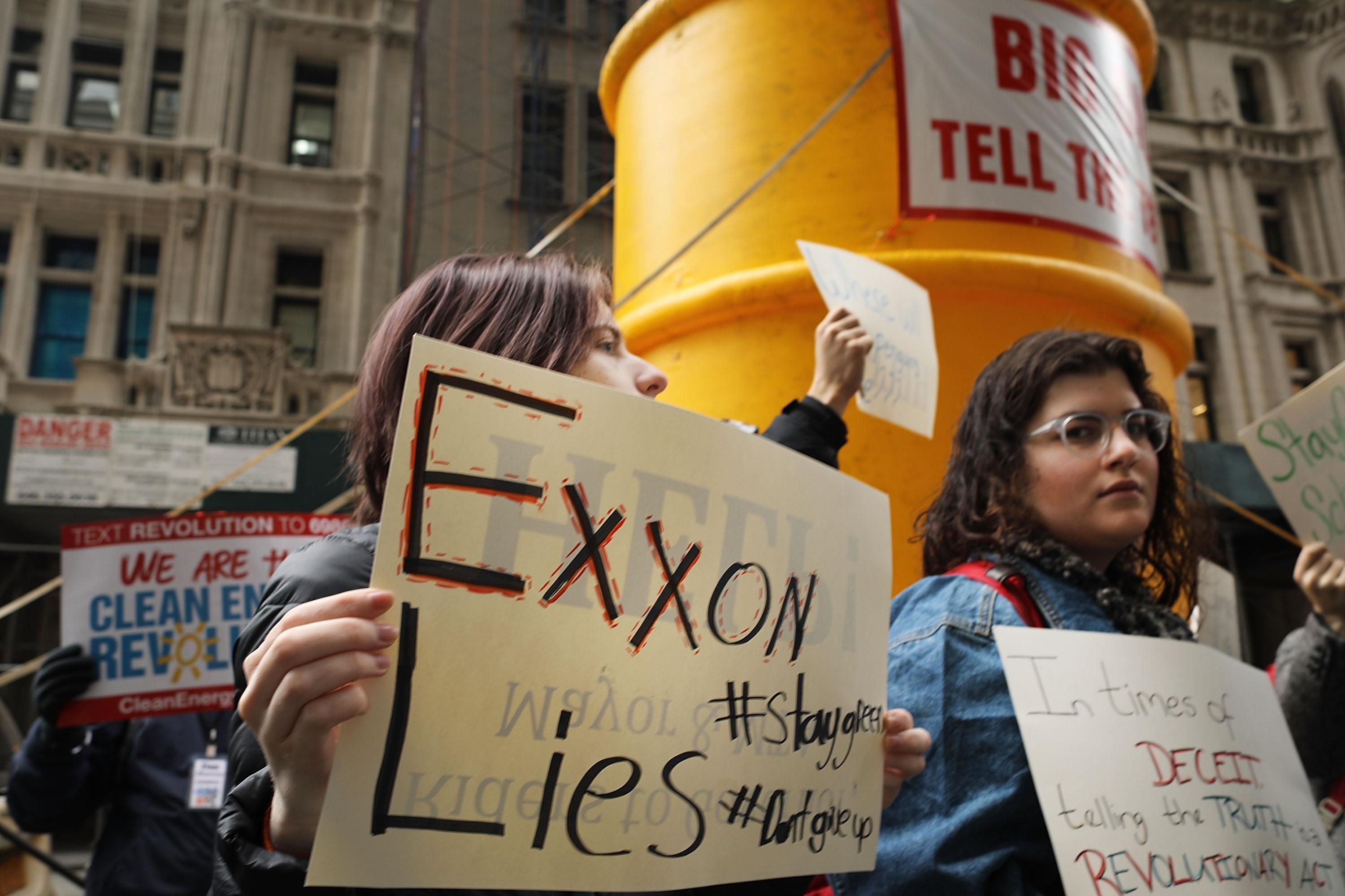 "Exxon lies" sign at protest
