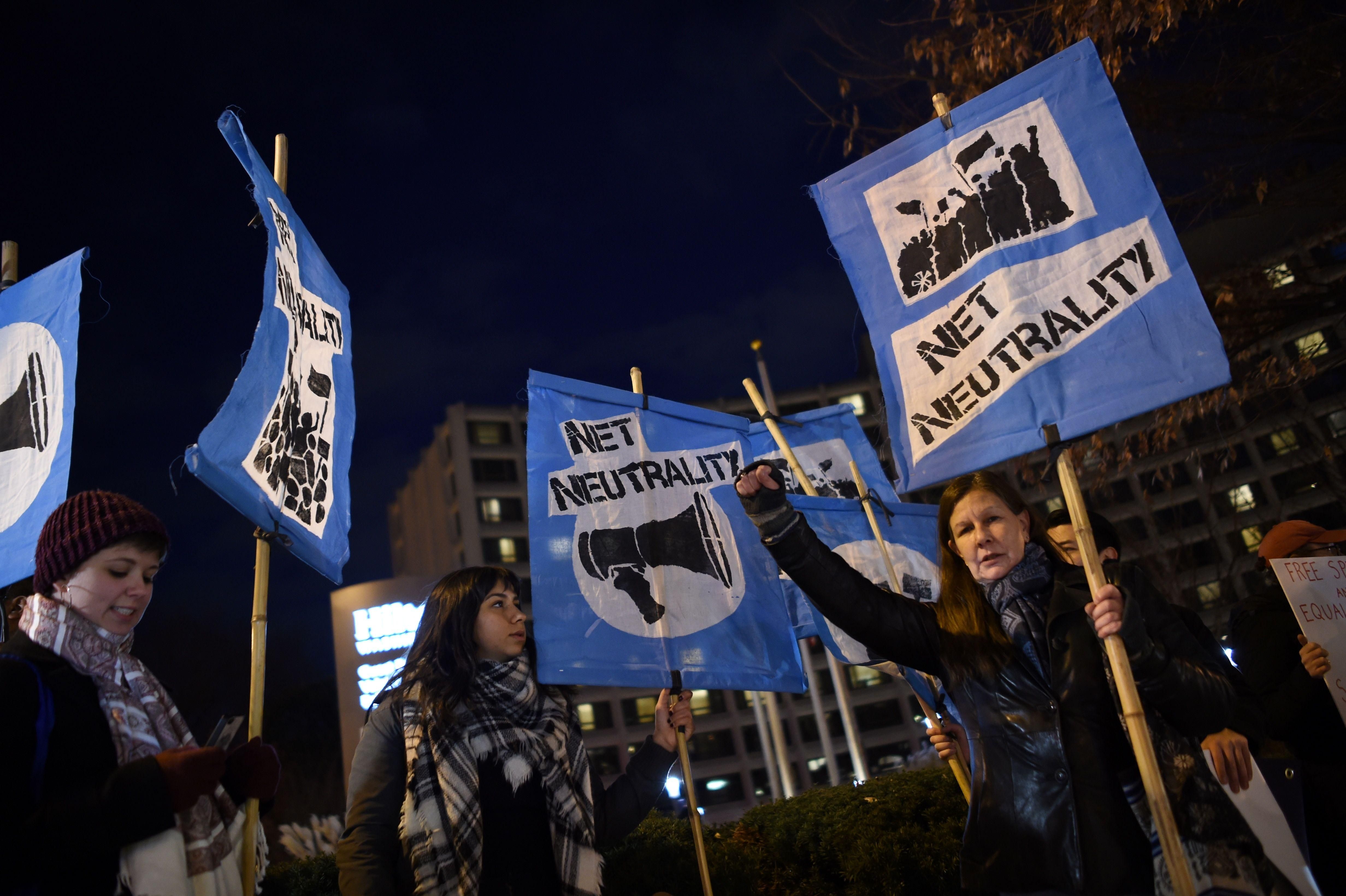 A small group of people supporting net neutrality protest against the proposals of then-Federal Communications Commission Chair Ajit Pai on December 7, 2017, in Washington, D.C.