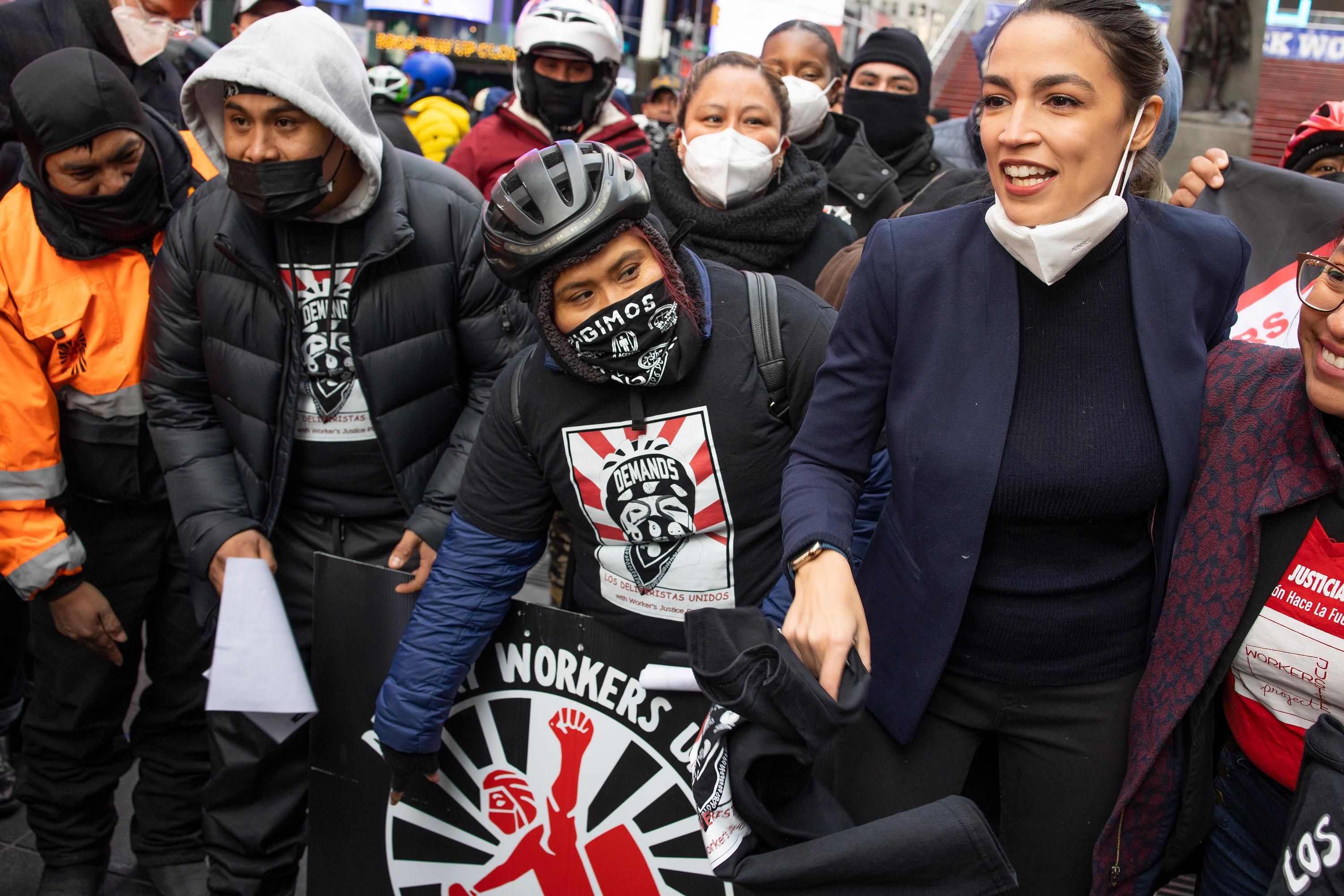 Rep. Alexandria Ocasio-Cortez with delivery workers