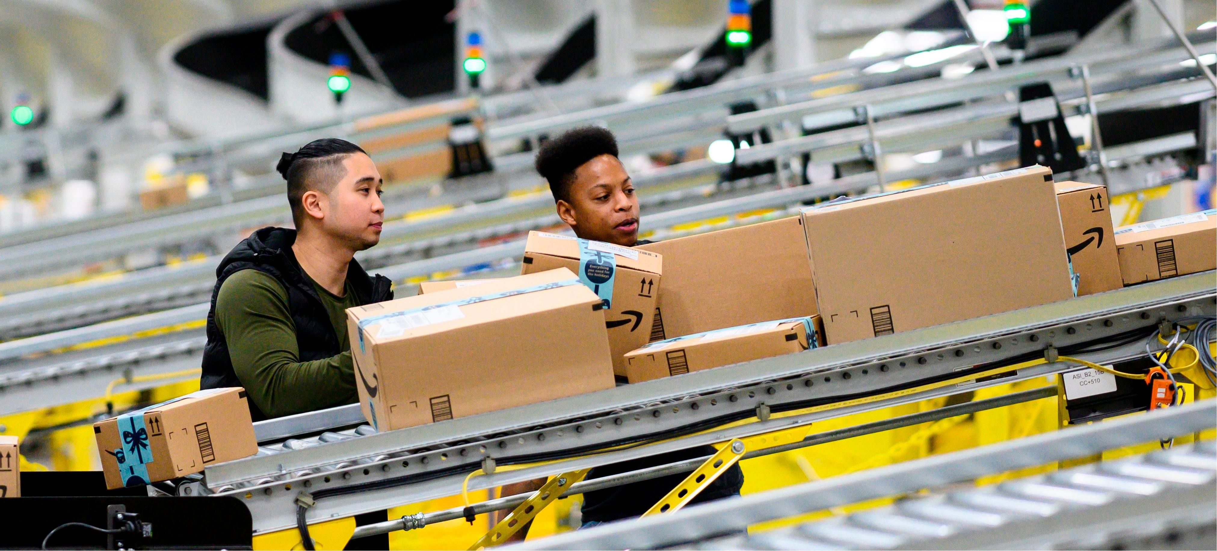 Workers in Amazon fulfilment warehouse