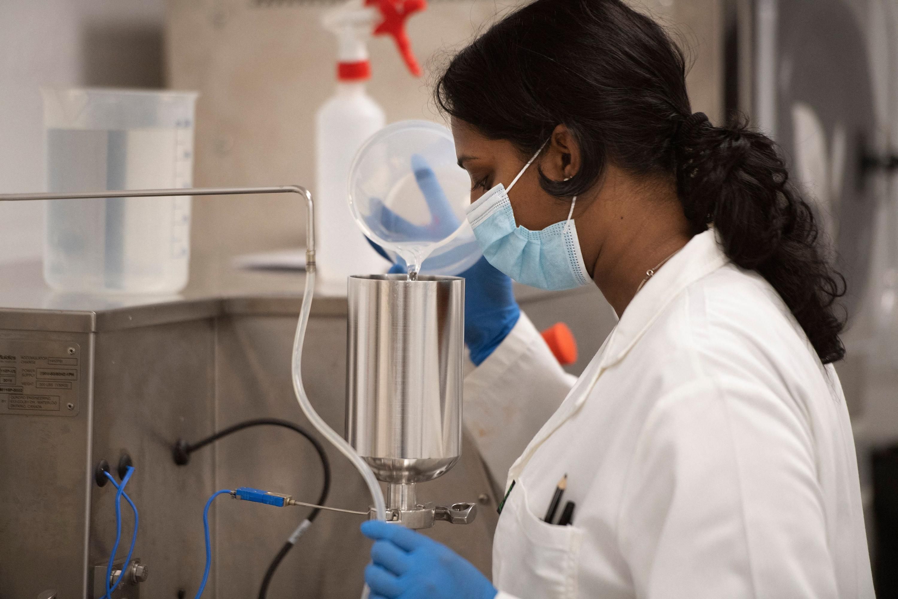 A South African researcher works in a vaccine lab