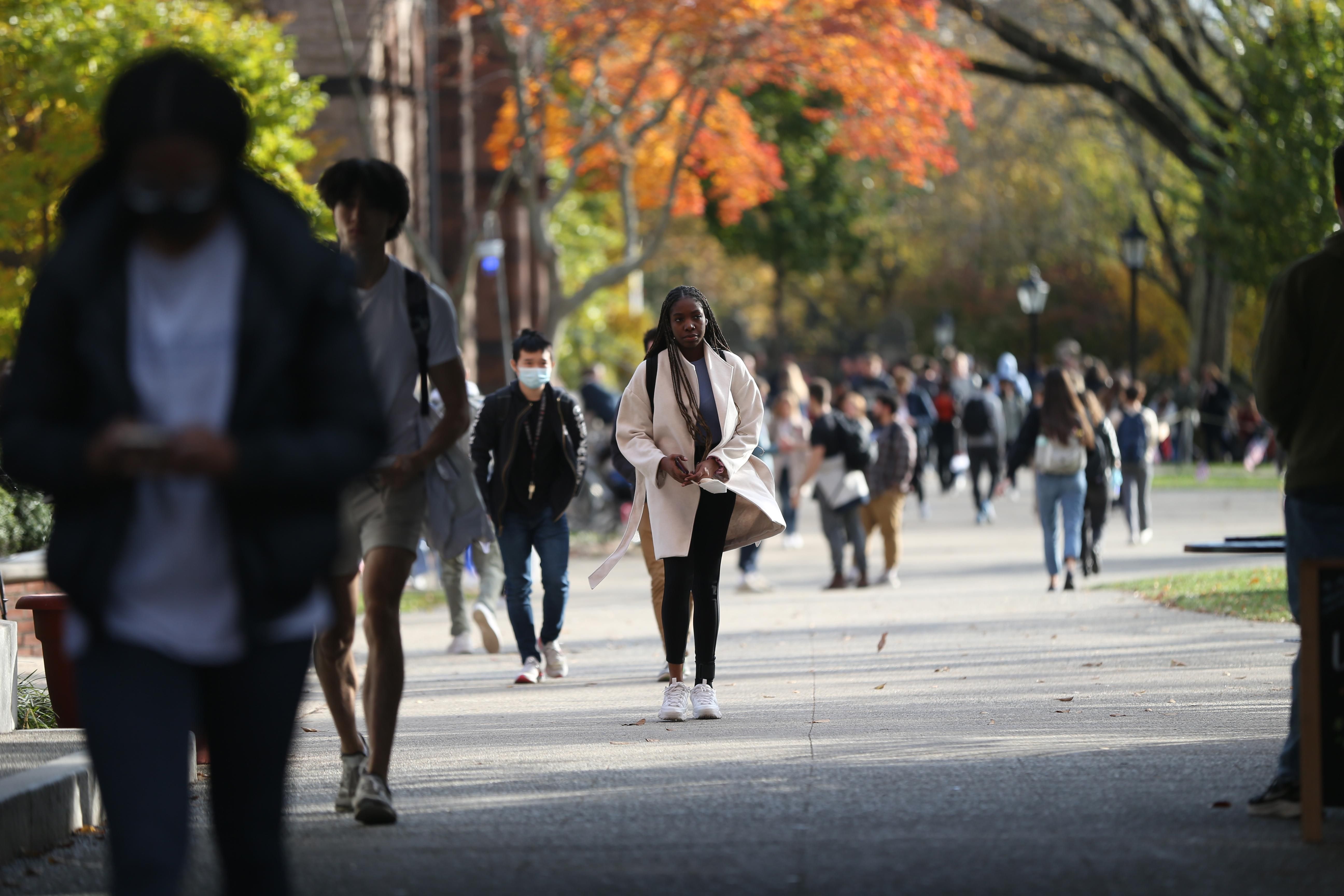 Students are seen walking on Brown University's campus in Providence, Rhode Island on November 11, 2021.