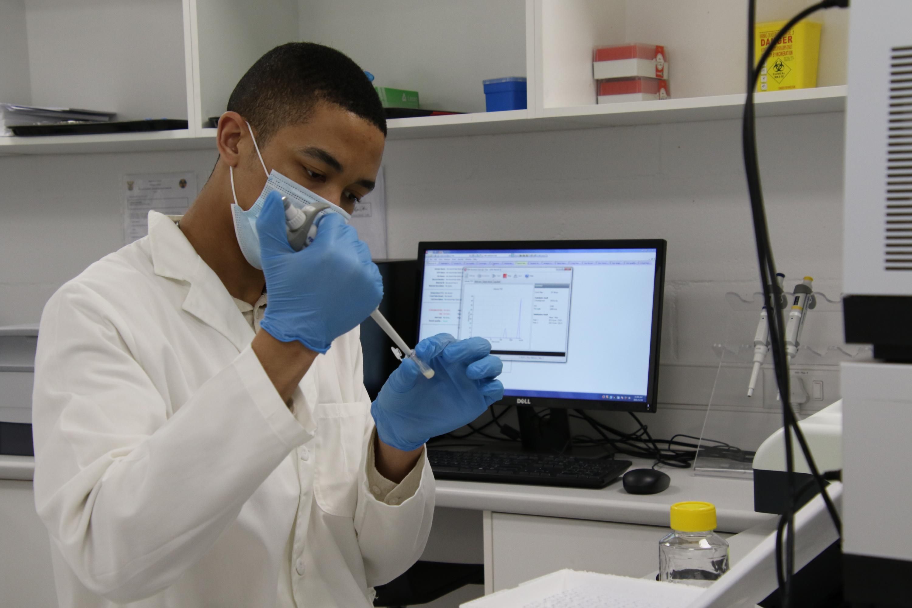 A researcher works in a lab in South Africa