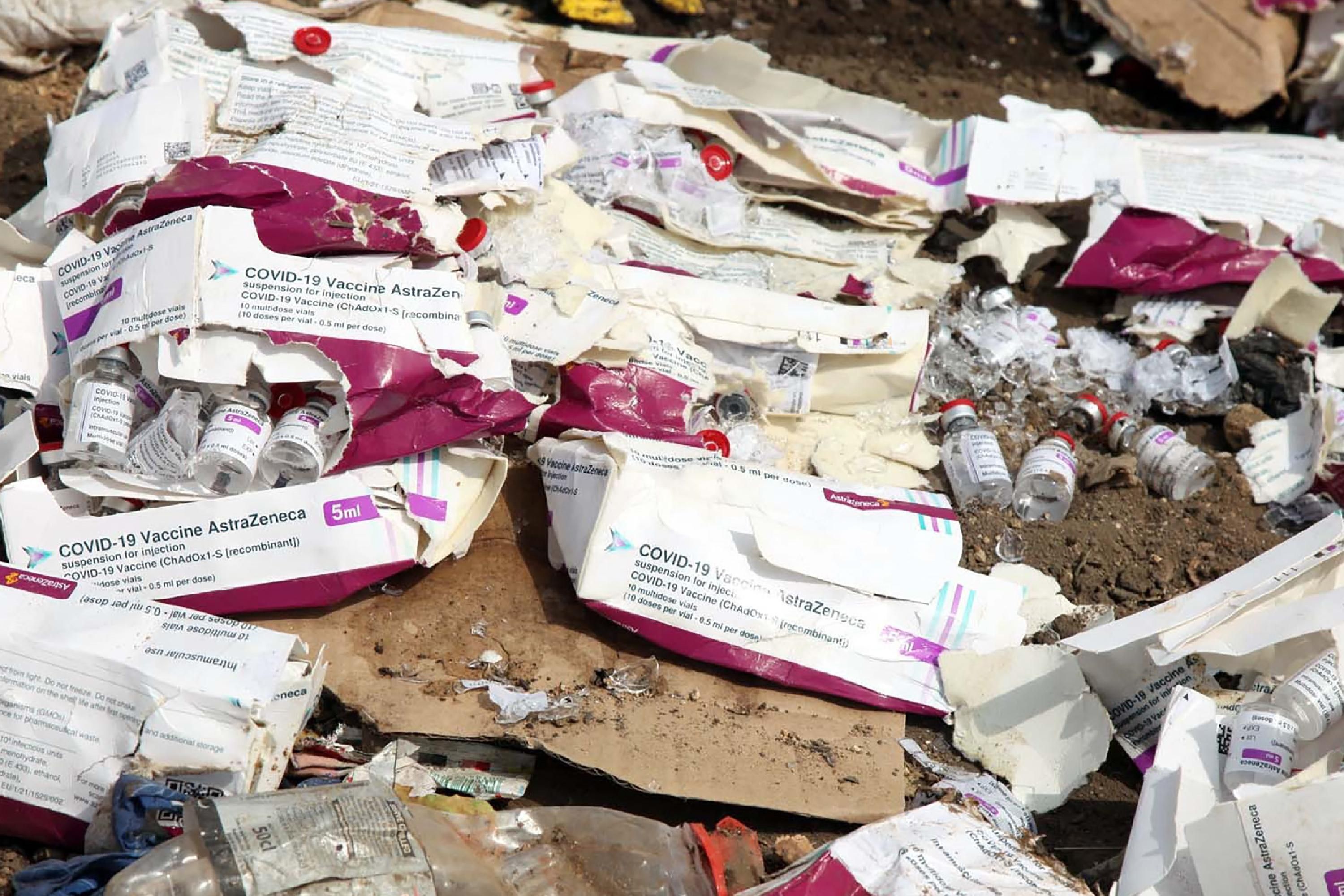 Expired vaccines pictured at a dumpsite
