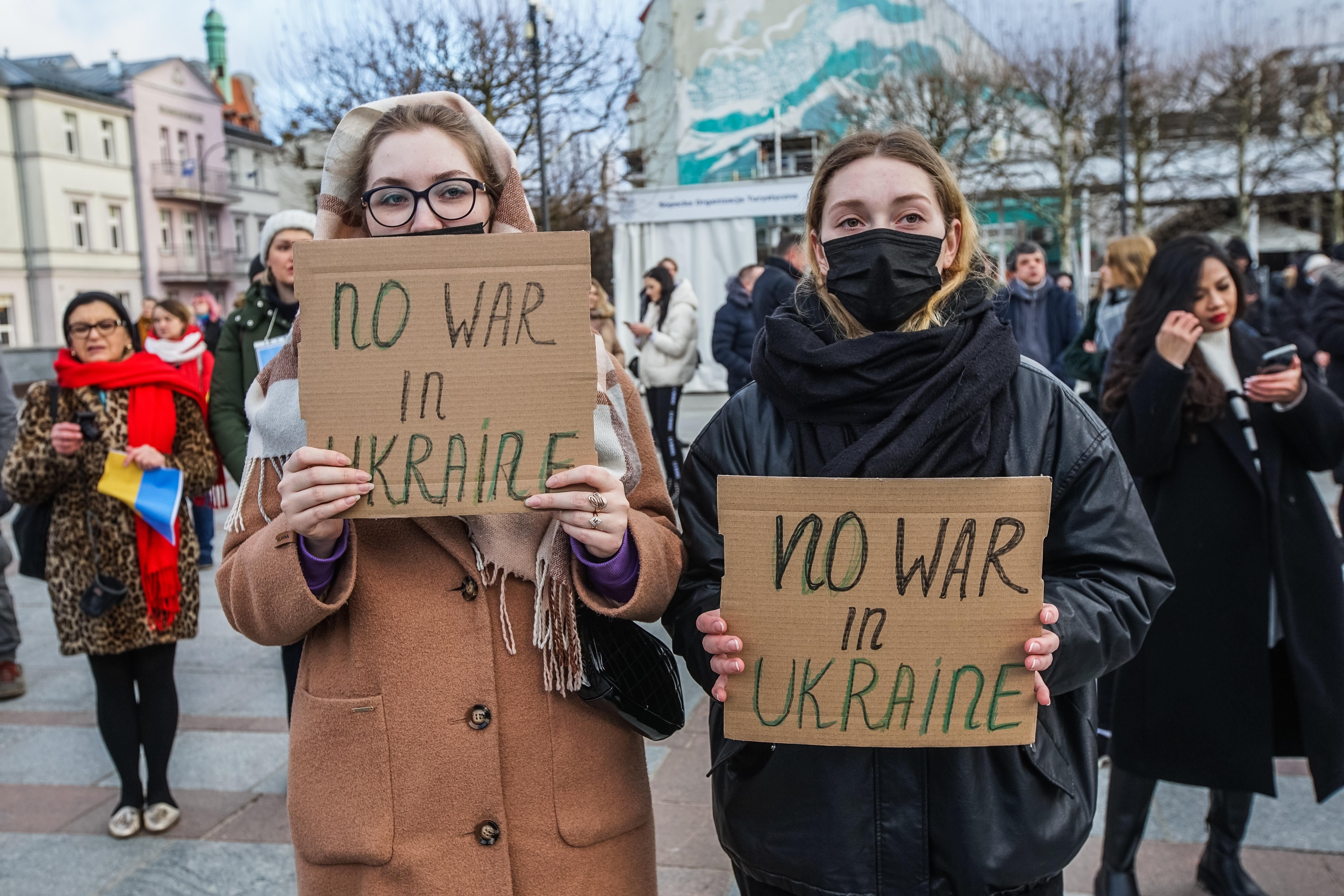 Protesters hold anti-war signs and Ukrainian flags in Sopot, Poland on February 26, 2022.
