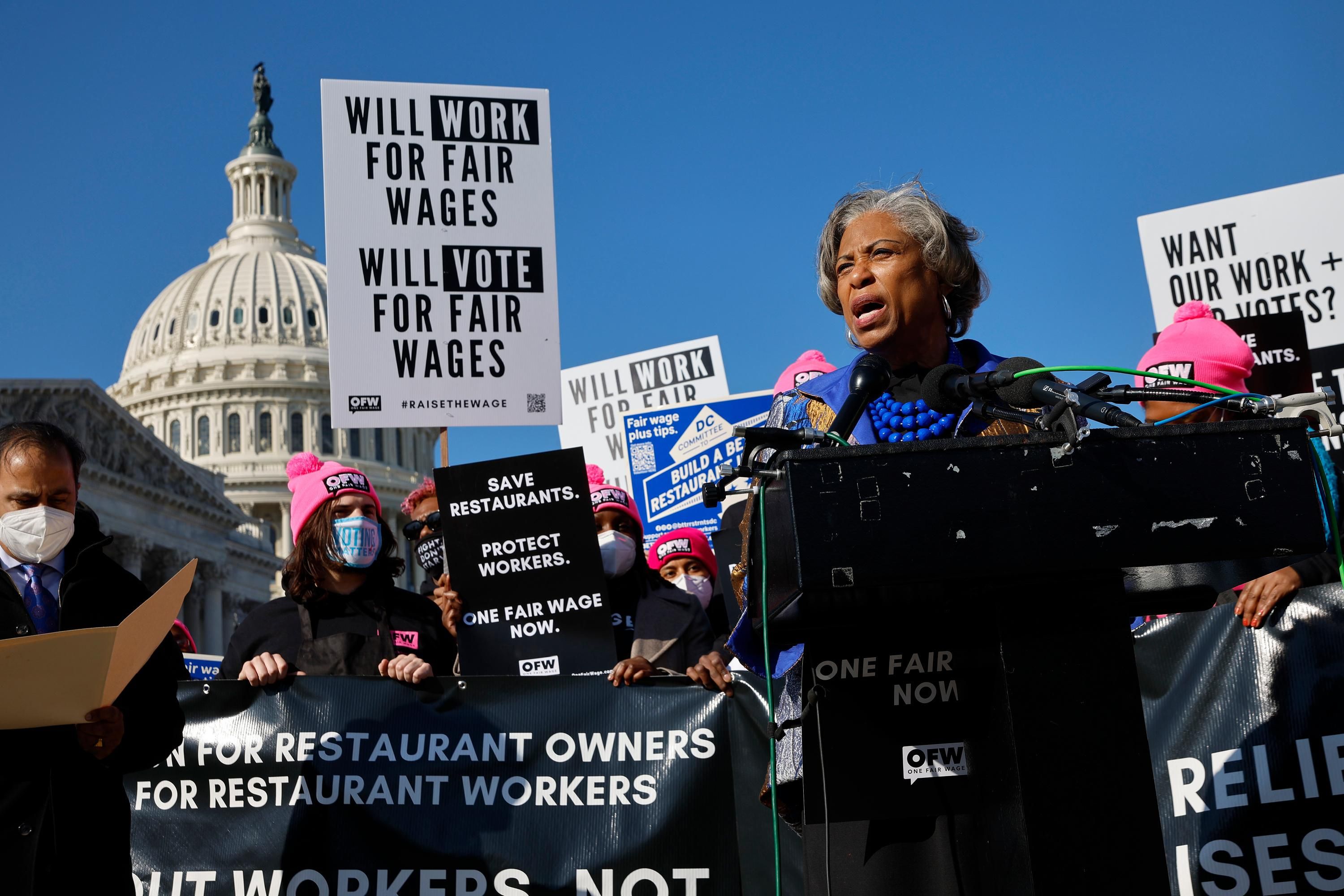 Restaurant workers attend a demonstration outside of Congress