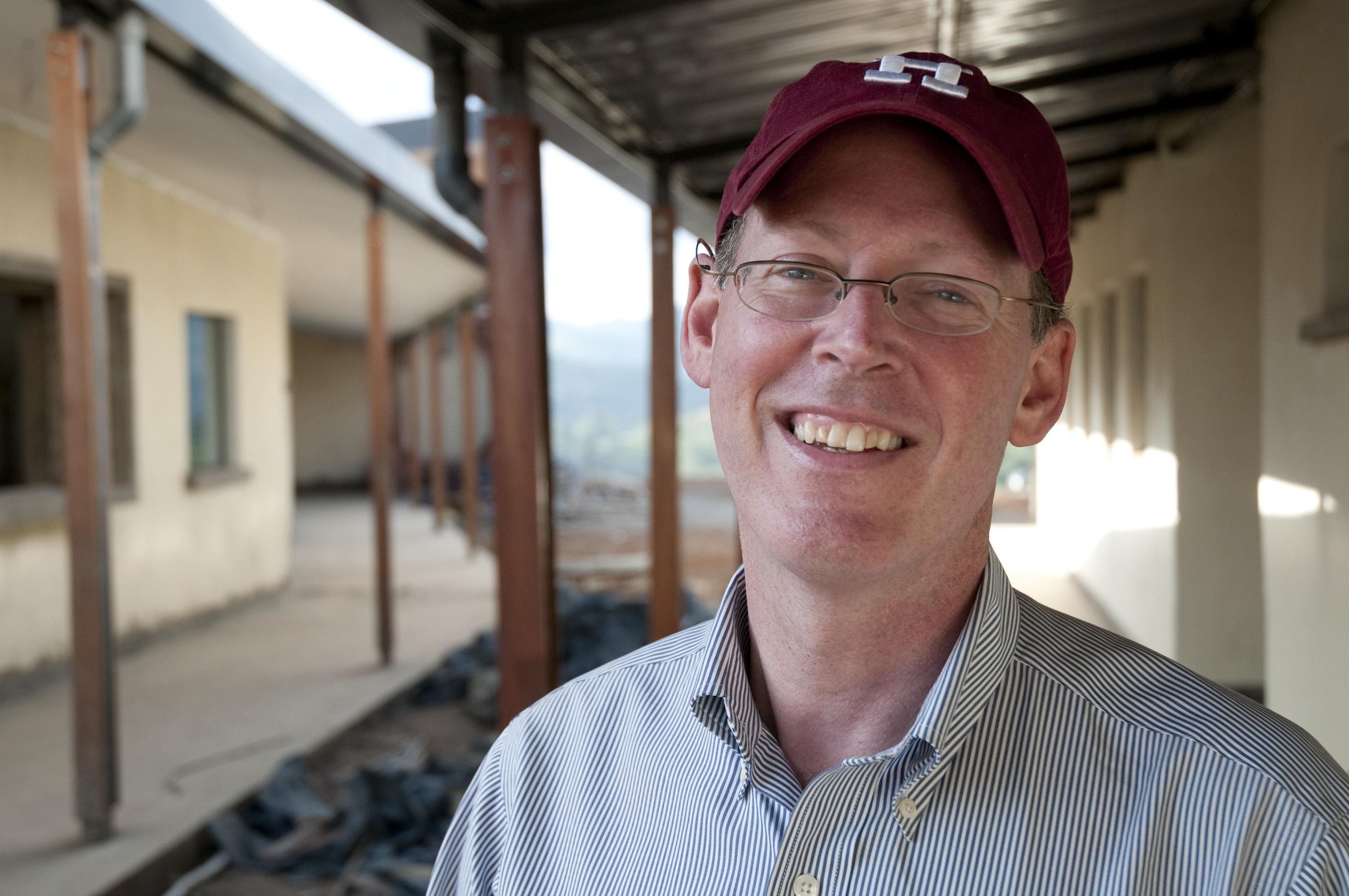 Dr. Paul Farmer stands outside the Butaro Hospital built by Partners in Health for the Rwanda Ministry of Health, on June 20, 2010 in Burera, Rwanda. 
