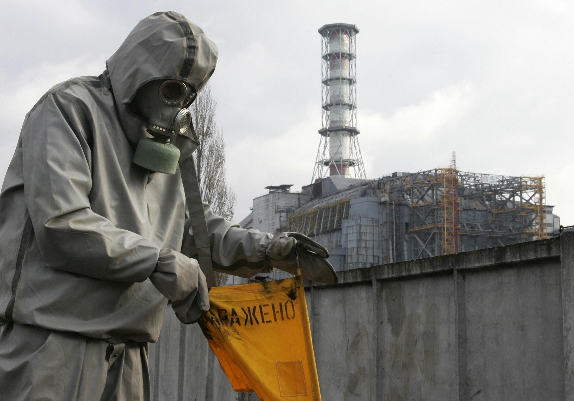 A worker sets a flag signaling radioactivity in front of the Chernobyl nuclear power plant during a drill organized by Ukraine's Emergency Ministry on November 8, 2006.