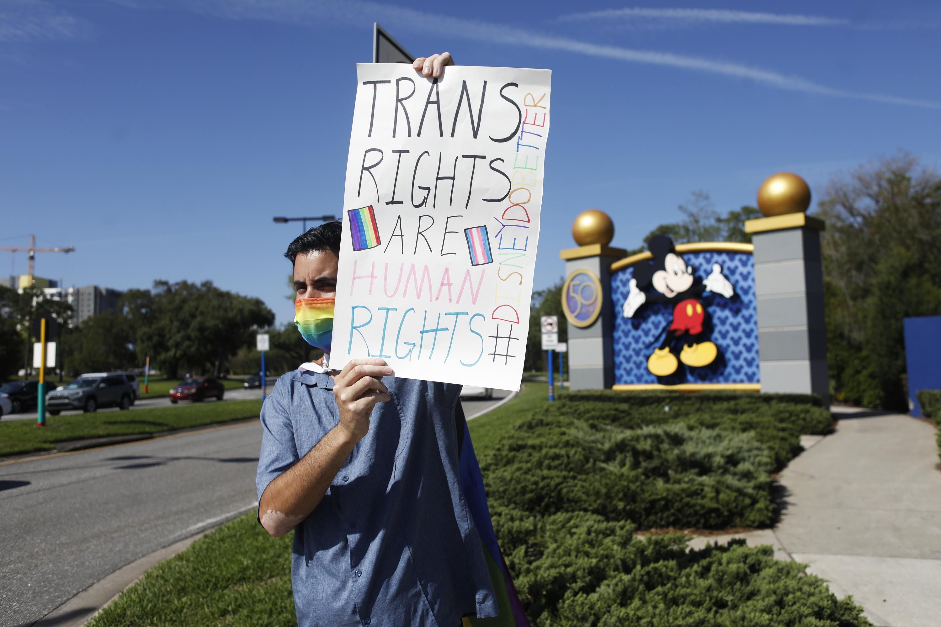 A Disney employee protests outside Walt Disney World