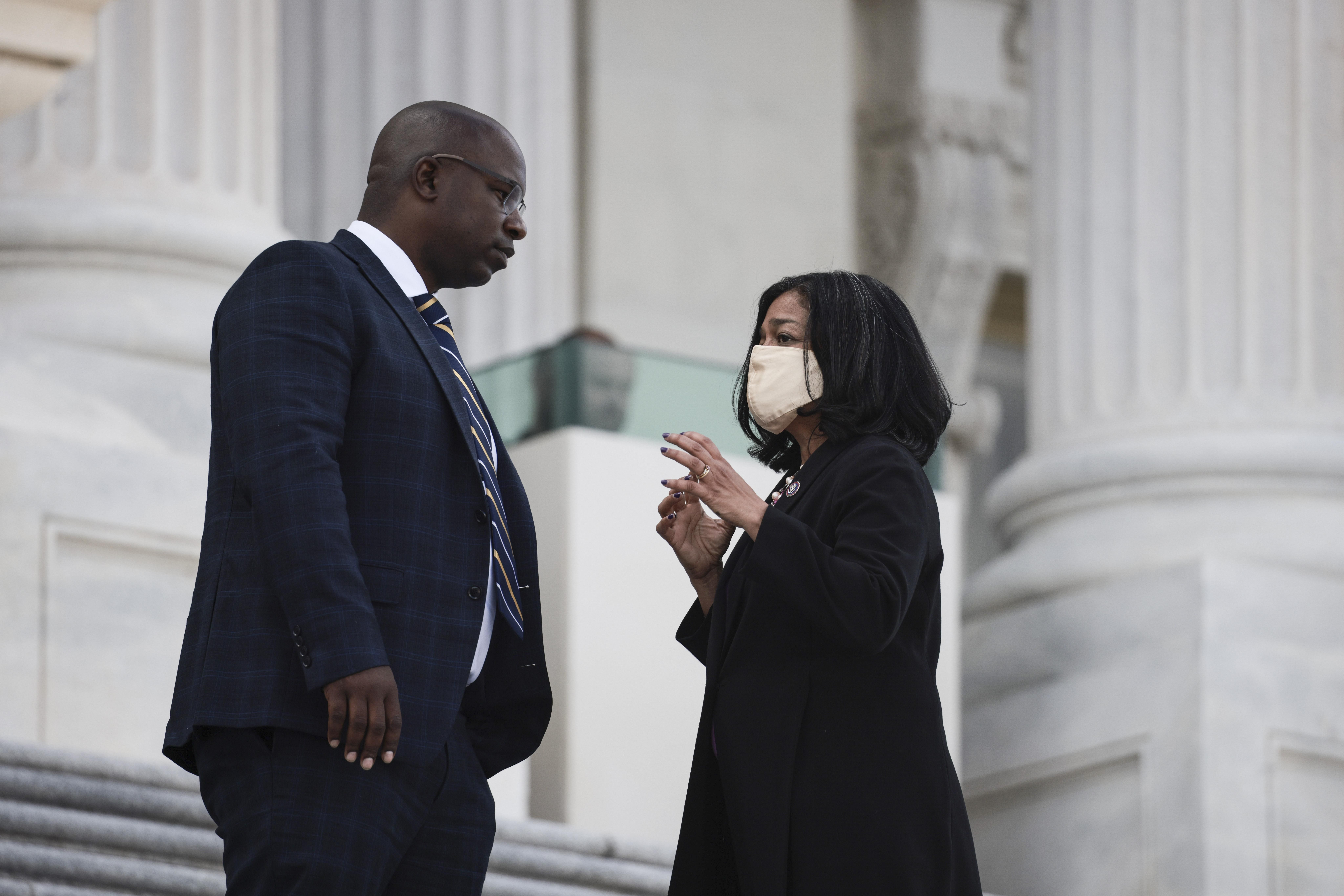 Democratic Reps. Jamaal Bowman (N.Y.) and Pramila Jayapal (Wash.) speak to one another on the steps to the U.S. Capitol on September 23, 2021 in Washington, D.C. 
