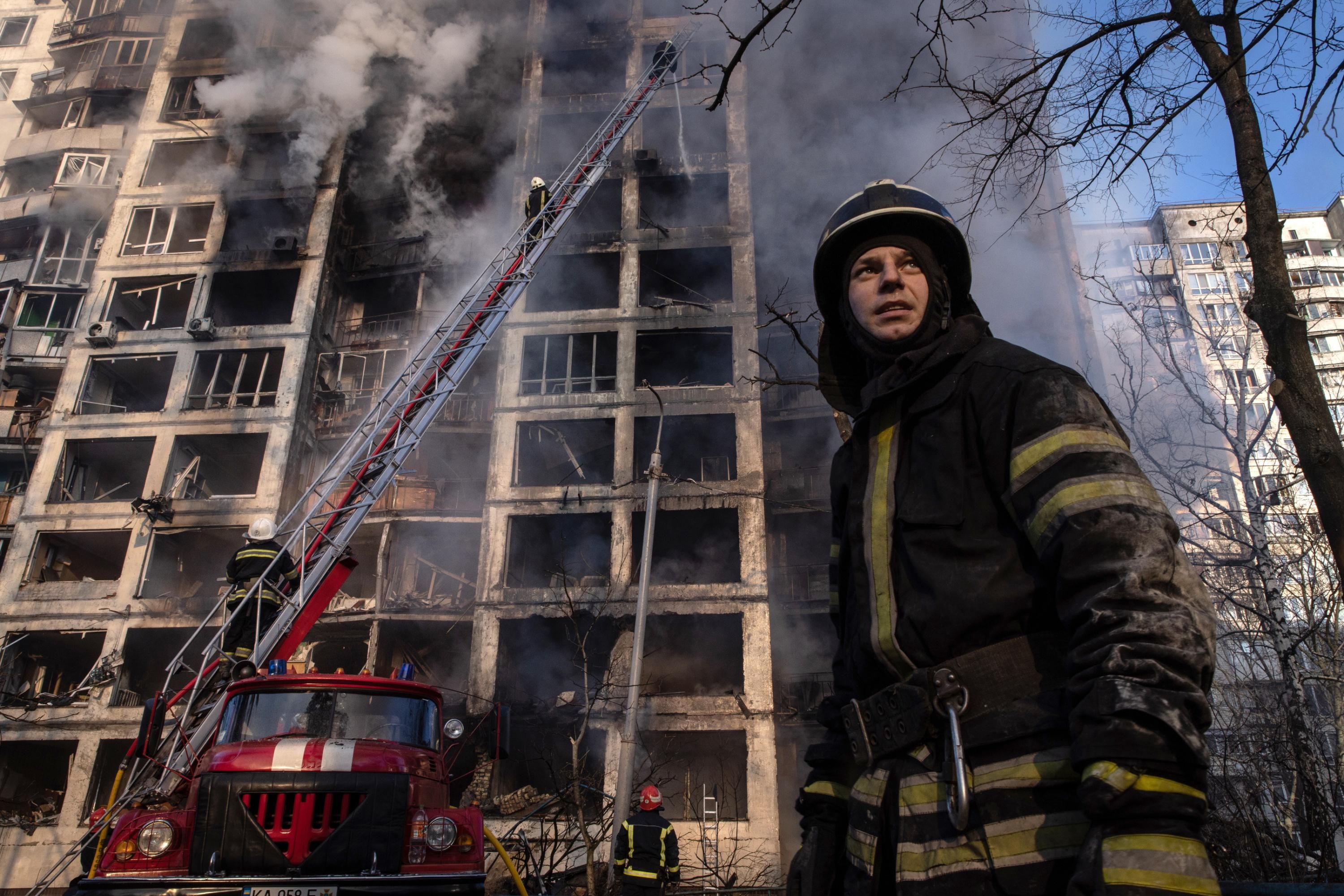 A firefighter seen near a residential building hit by a Russian strike