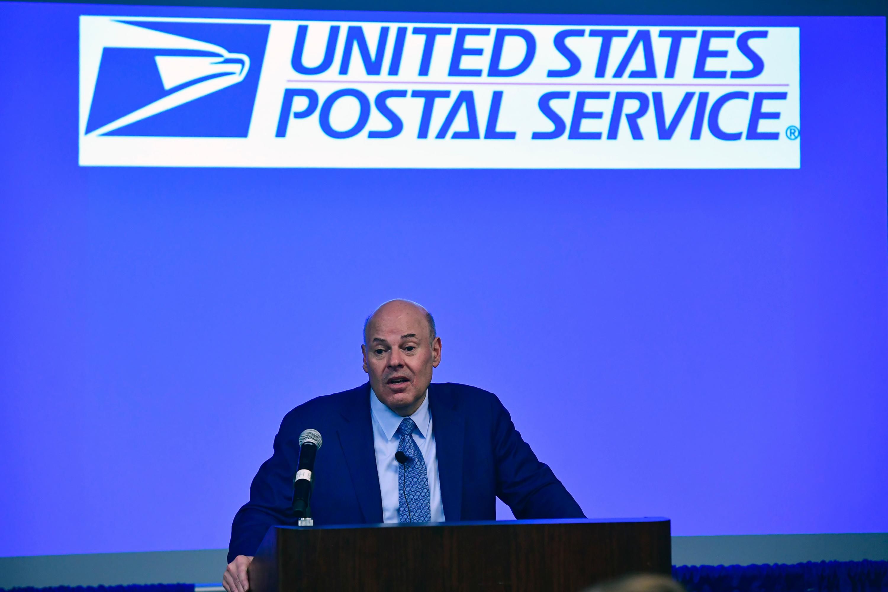 Postmaster General Louis DeJoy speaks at an event