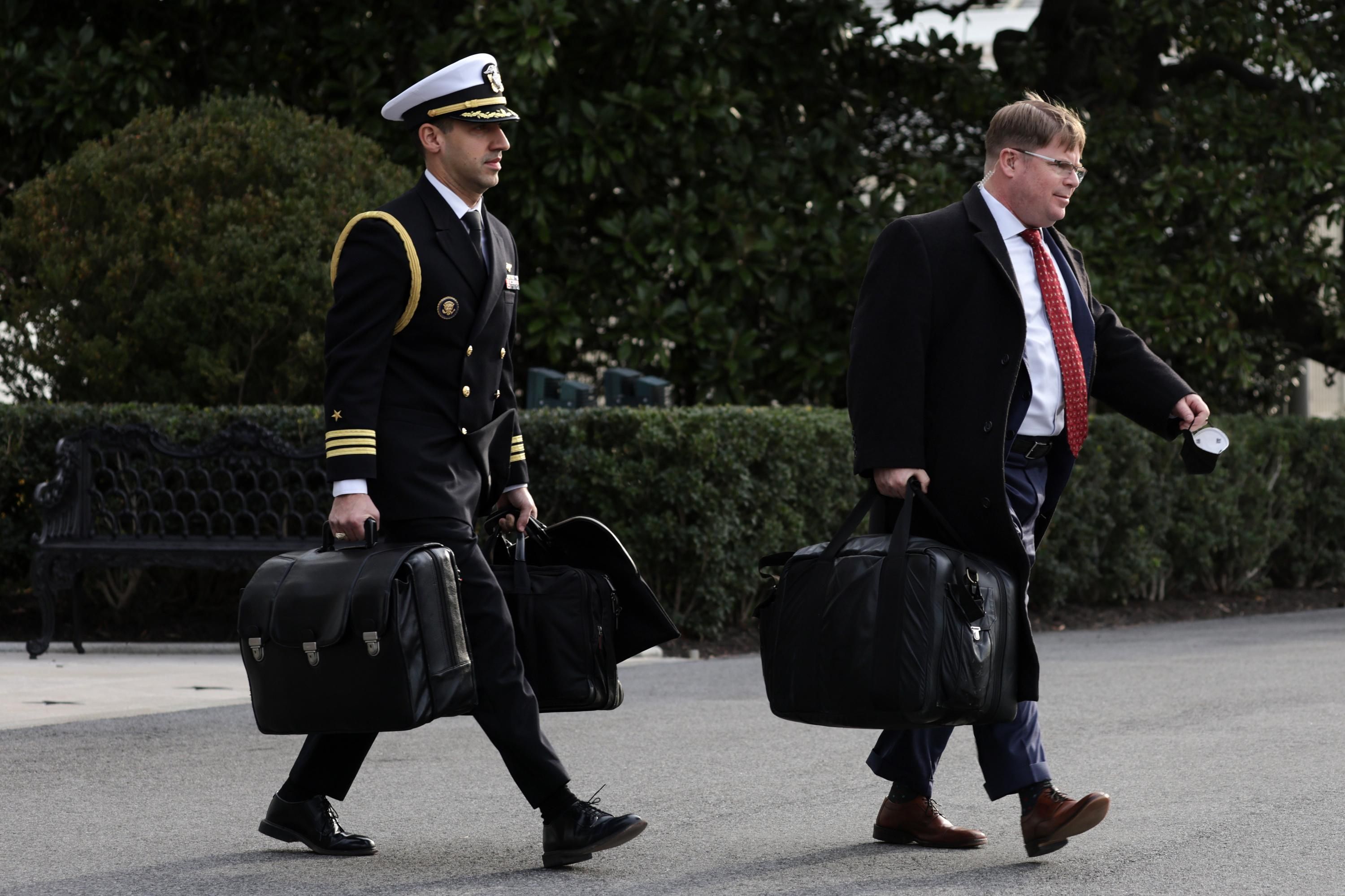 A military aide carries the so-called "nuclear football"