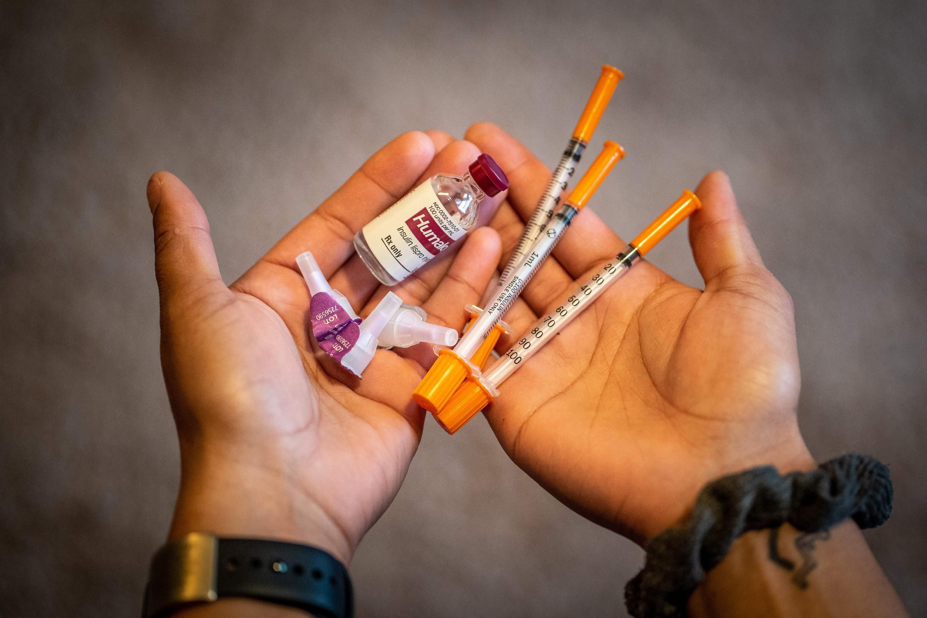 A patient holds insulin