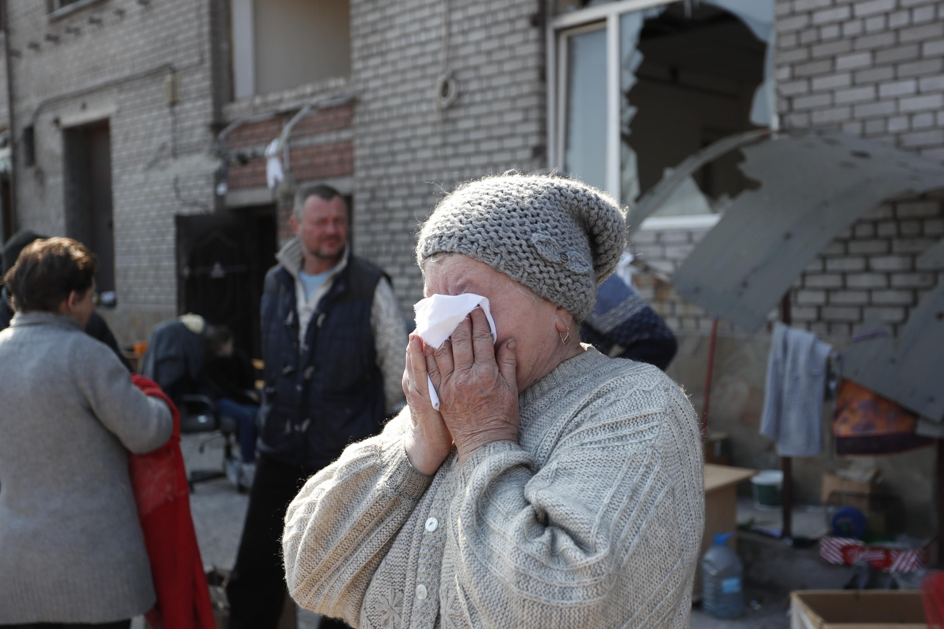 Mariupol residents are seen in the city