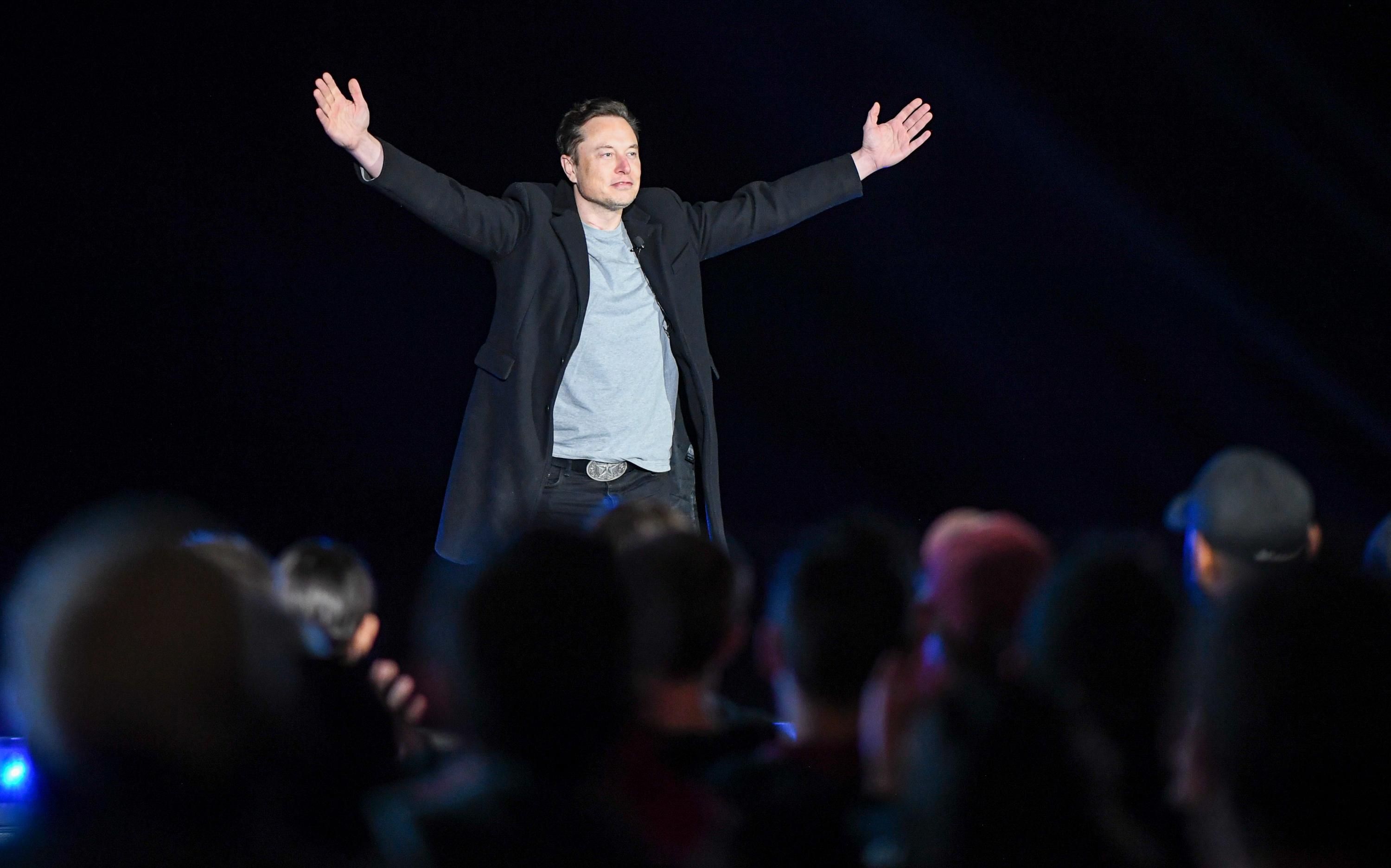 Elon Musk addresses a crowd