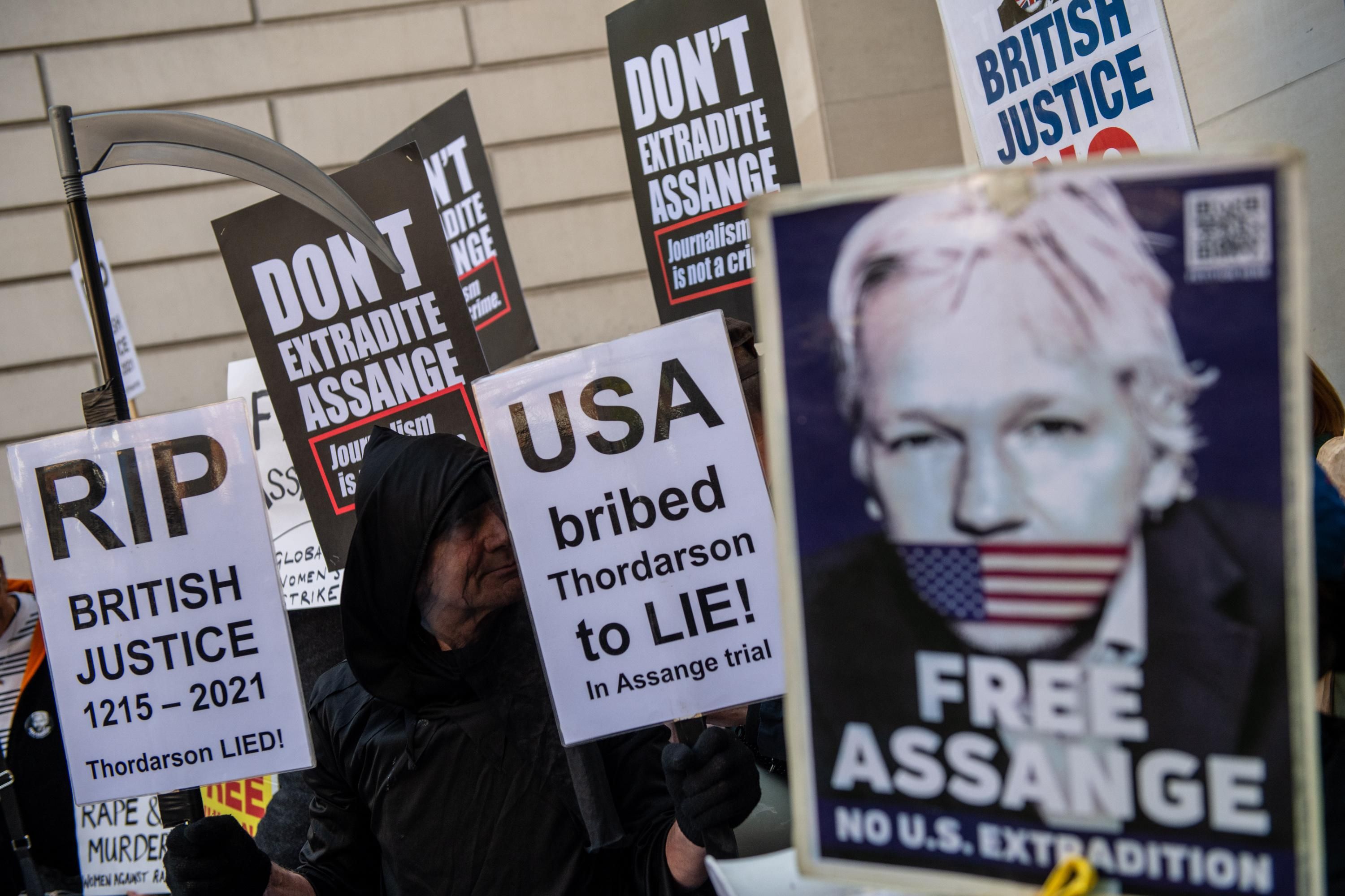 Supporters of Julian Assange rally outside of a court hearing in London