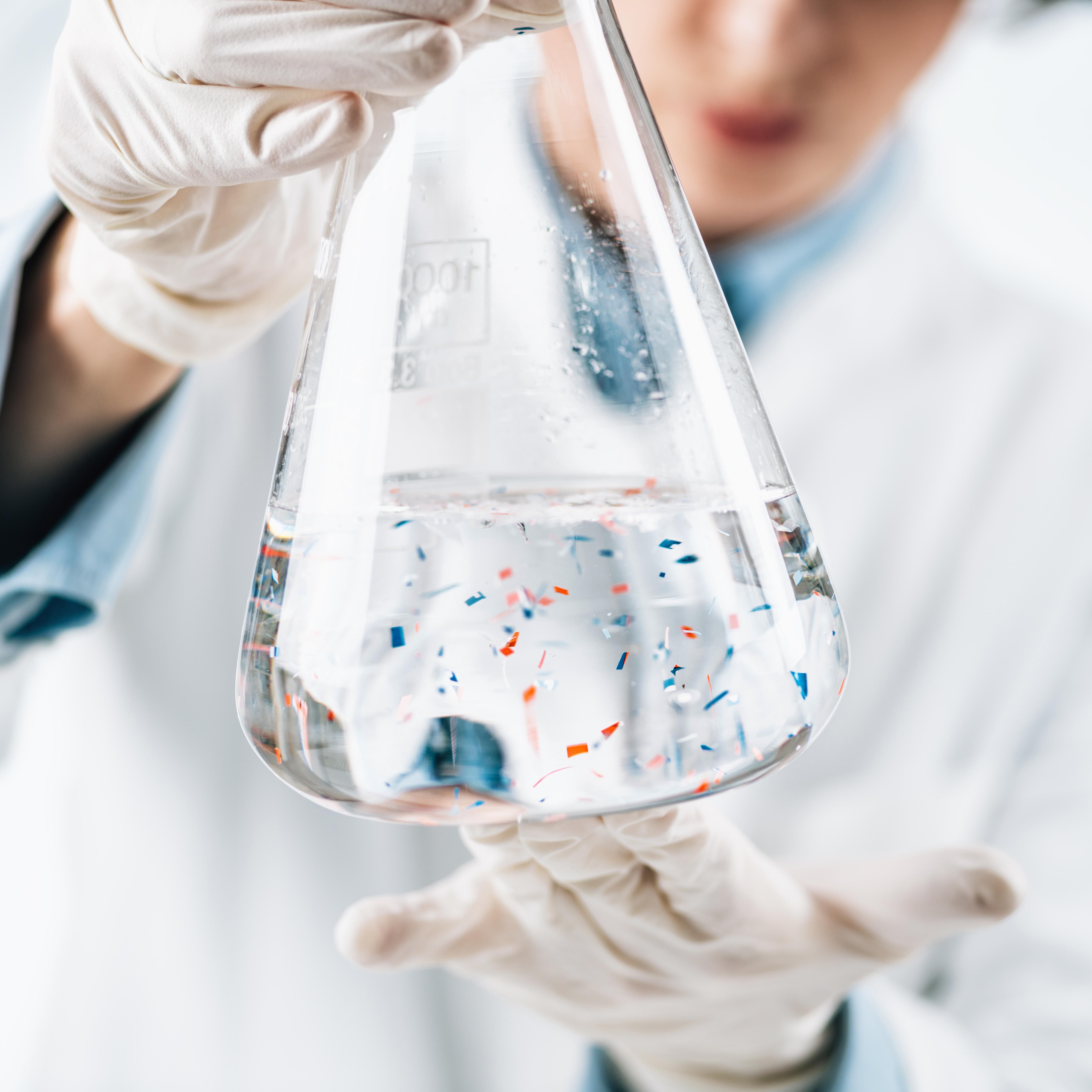 A scientist examines microplastics